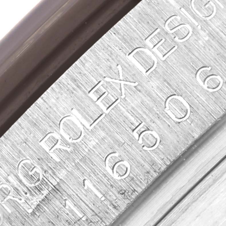 The image shows a close-up of the inner bezel engraving on a Rolex Daytona 116506 Men's Platinum Blue Dial 116506 Men's Platinum Blue Dial watch.