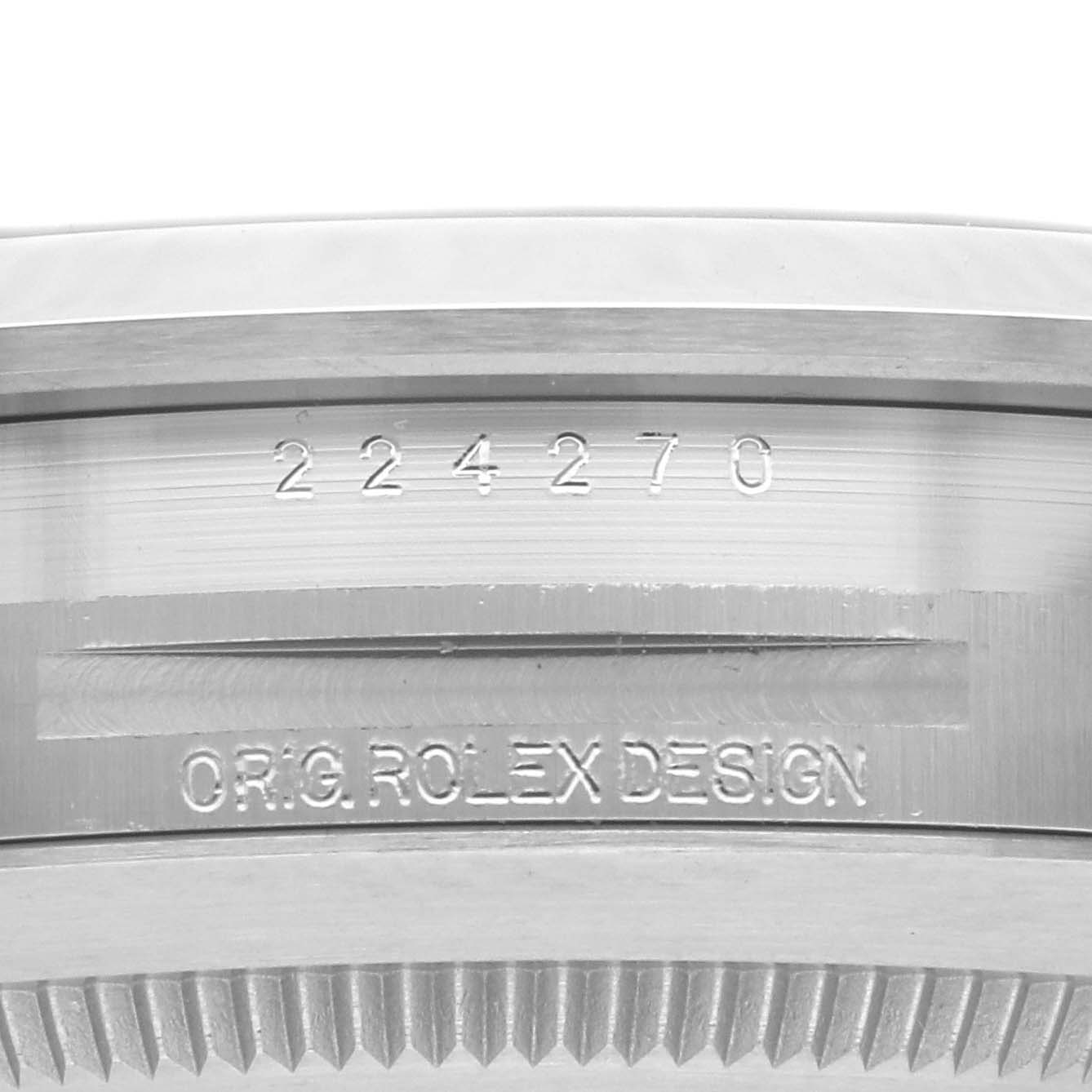 The image shows the engraved side of the case of a Rolex Explorer 224270 Men
s Stainless Steel Black Dial 224270 Men
s Stainless Steel Black Dial, displaying model numbers and "ORIG. ROLEX DESIGN."