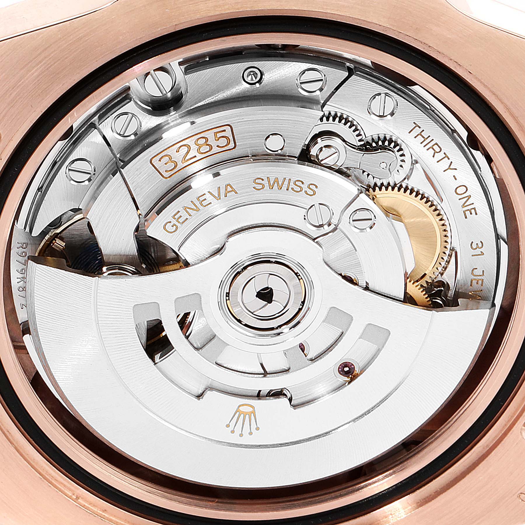 This image shows a close-up of the movement mechanism of a Rolex GMT-Master 126715 Men's Rose Gold Black Dial 126715 Men's Rose Gold Black Dial watch, specifically the Caliber 3285.