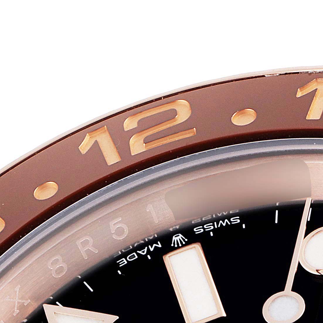 This close-up image shows the bezel, a portion of the dial, and the "Swiss Made" label of a Rolex GMT-Master 126715 Men's Rose Gold Black Dial 126715 Men's Rose Gold Black Dial watch.