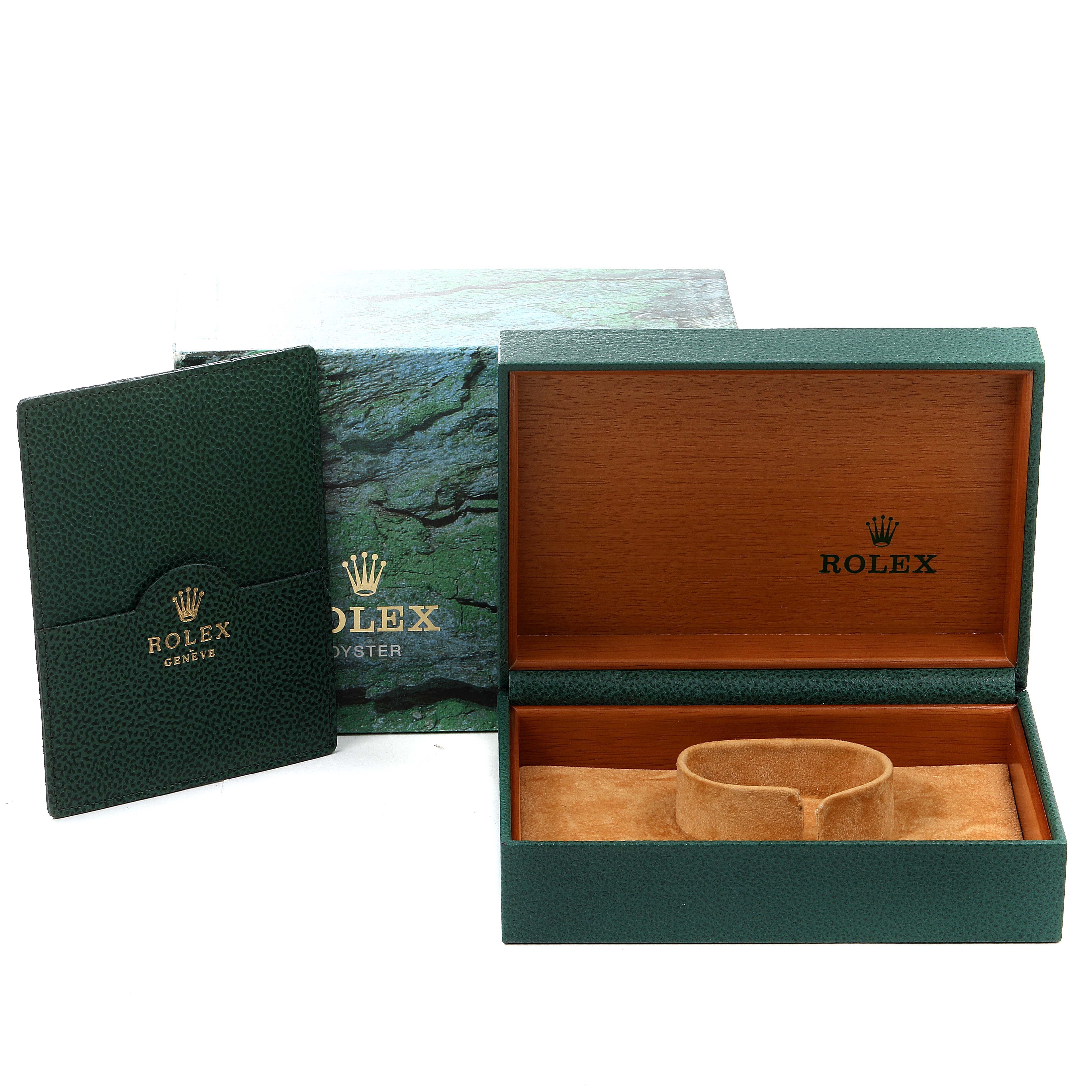 The image shows a green Rolex GMT-Master 16710 Men
s Stainless Steel Black Dial 16710 Men
s Stainless Steel Black Dial watch box, with its inner cushion, outer box, and a green Rolex booklet.