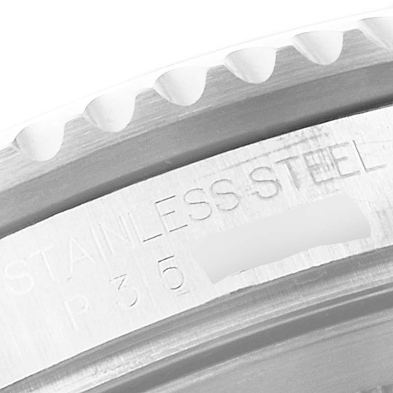 This close-up image shows the engraved bezel rim of a Rolex GMT-Master 16710 Men
s Stainless Steel Black Dial 16710 Men
s Stainless Steel Black Dial watch made of stainless steel.