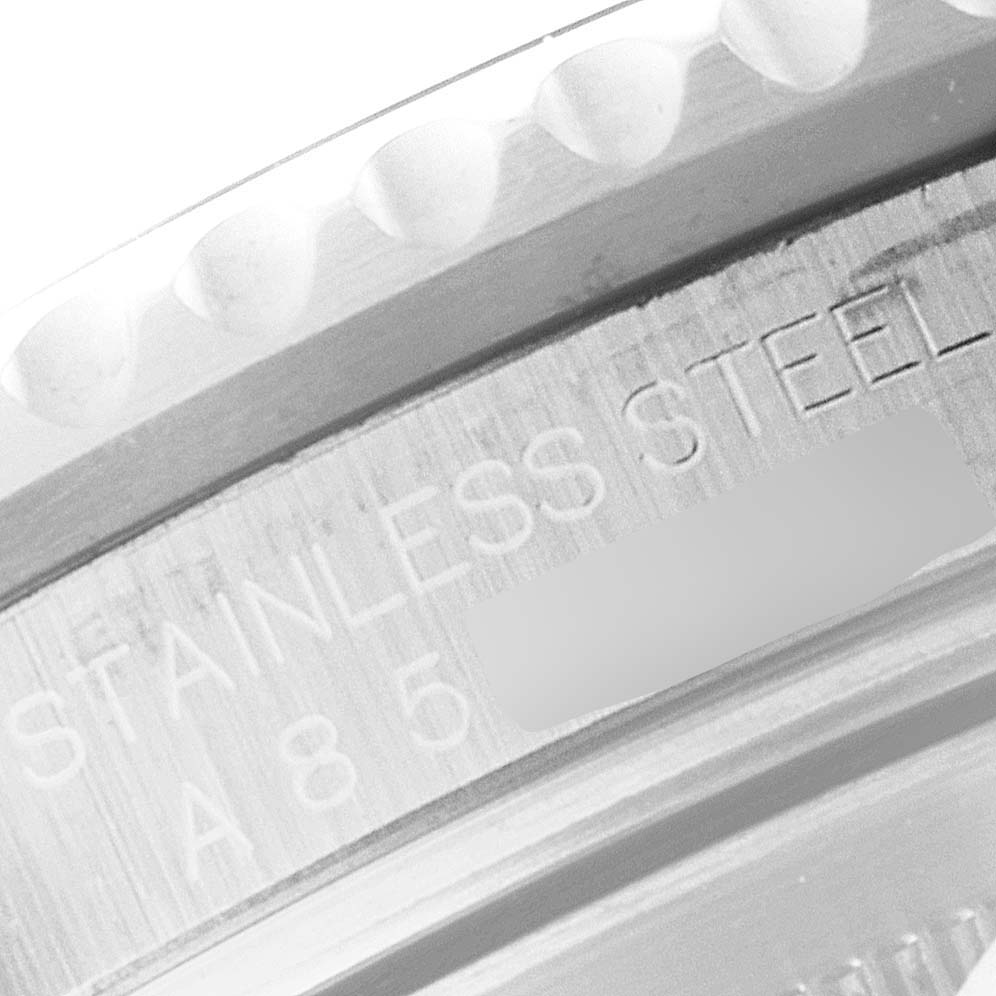 This is a close-up image of the side of a Rolex GMT-Master 16710 Men
s Stainless Steel Black Dial 16710 Men
s Stainless Steel Black Dial watch, showing the stainless steel engraving and part of the bezel.