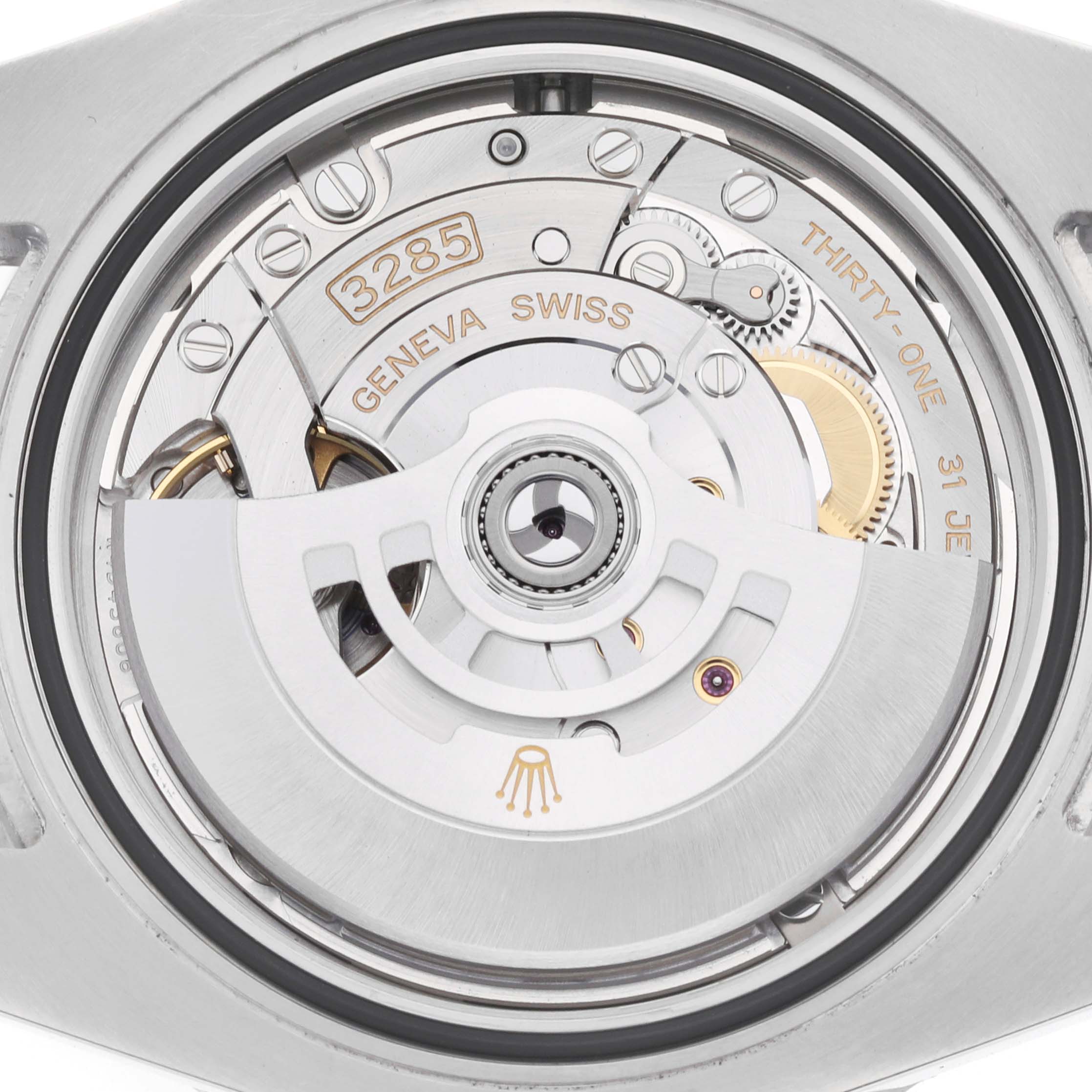 The image shows the movement of a Rolex GMT-Master 126710 Men's Stainless Steel Black Dial, highlighting the intricate inner mechanics from a rear angle.