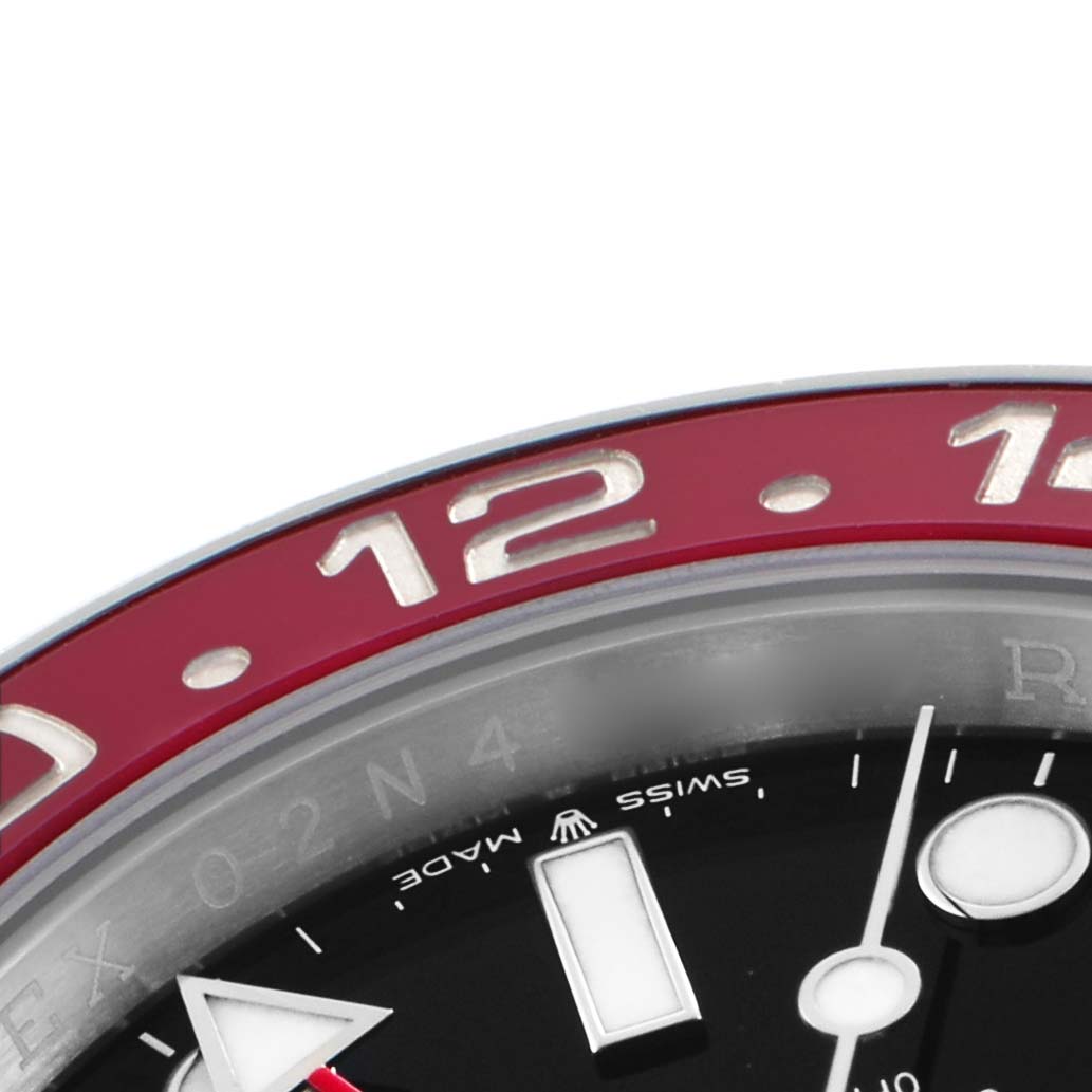 The image shows a close-up of the Rolex GMT-Master 126710 Men's Stainless Steel Black Dial watch, focusing on the upper bezel and partial dial.