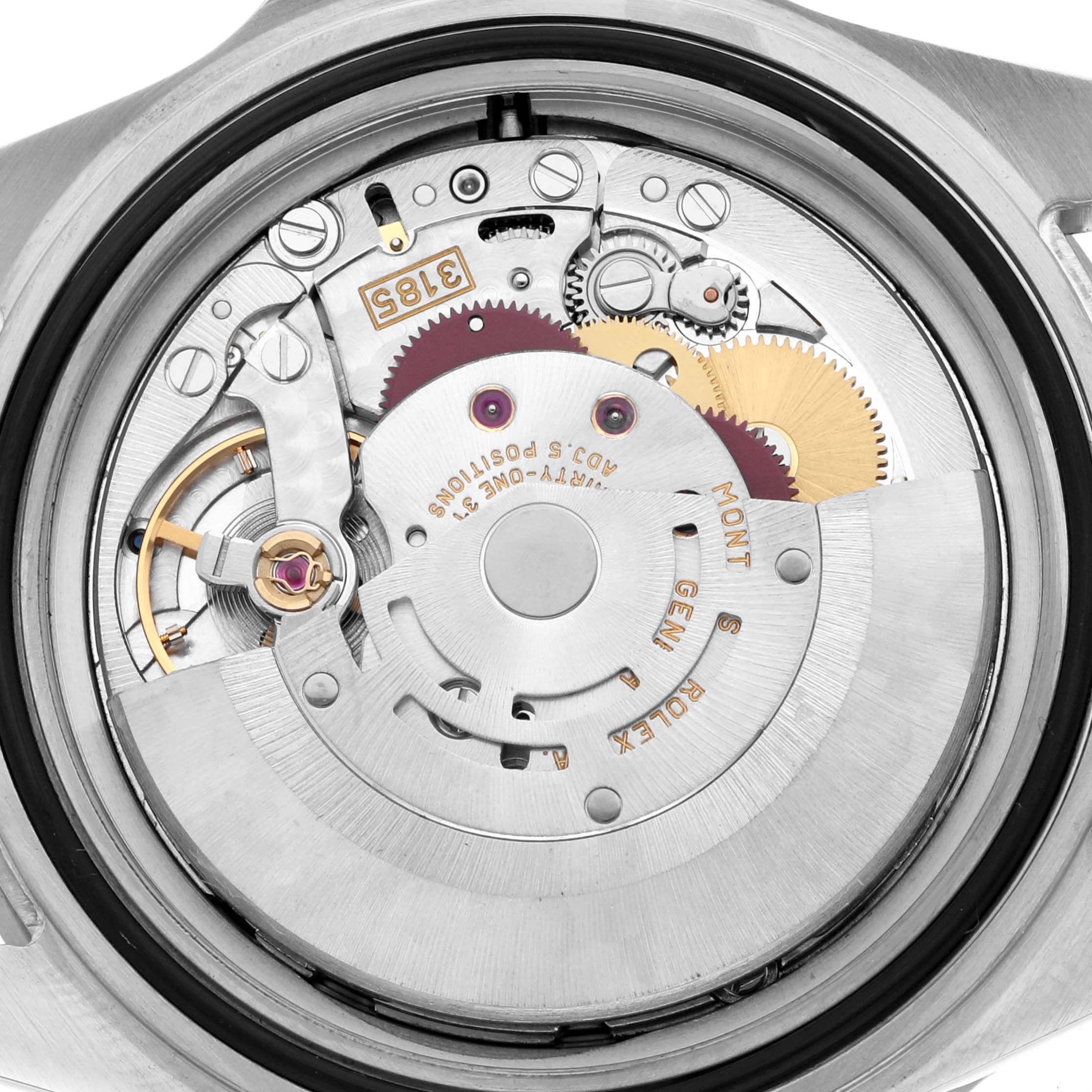 The image shows a close-up view of the Rolex GMT-Master 16710 Men's Stainless Steel Black Dial’s movement, highlighting gears and mechanical components.