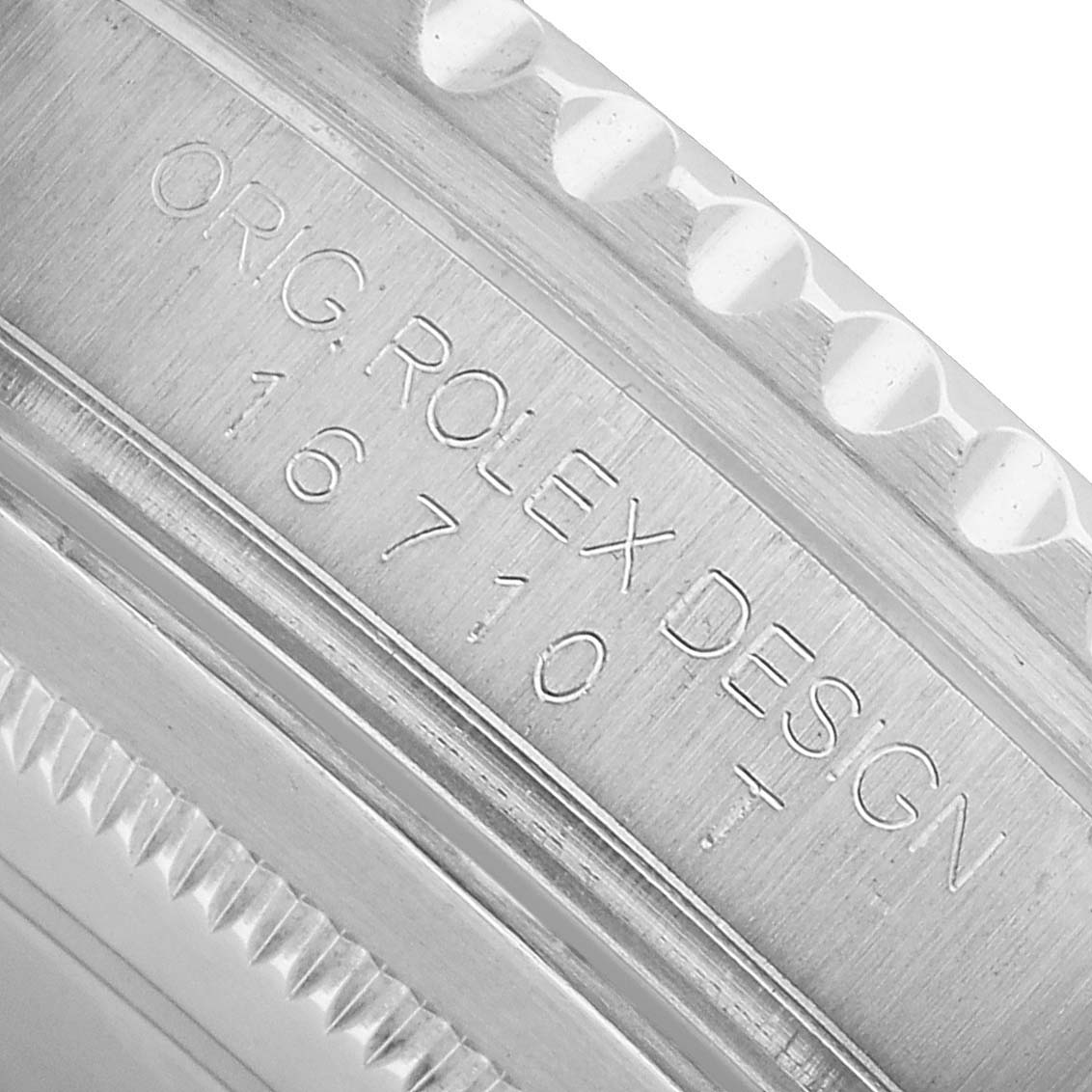 The image shows a close-up side view of the Rolex GMT-Master 16710 Men's Stainless Steel Black Dial model, highlighting the engraved case design number.