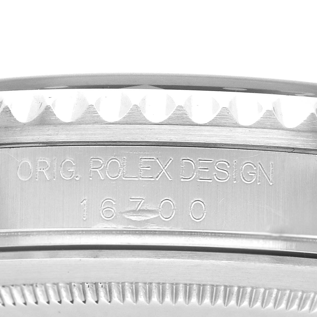 The image shows the side of a Rolex GMT-Master 16700 Men's Stainless Steel Black Dial, focusing on the bezel and the engraved model number 16700.
