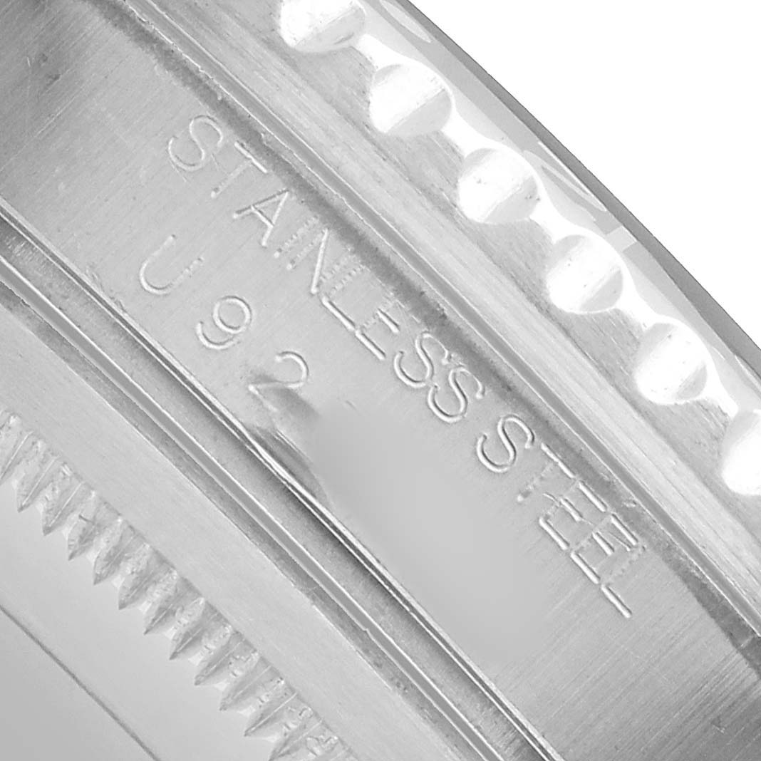 The image shows a close-up of the case edge and engraving on the Rolex GMT-Master 16700 Men's Stainless Steel Black Dial indicating "STAINLESS STEEL."