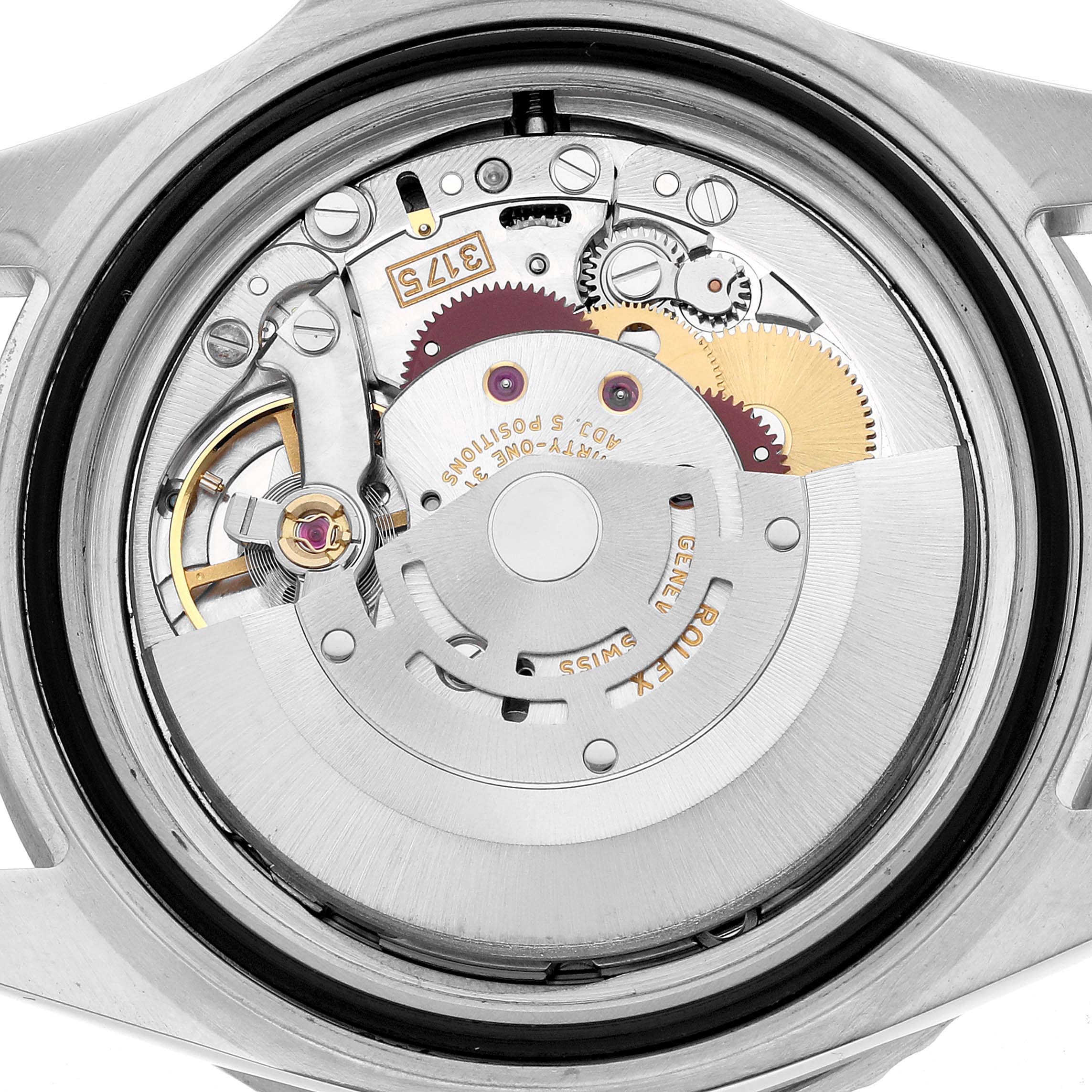 The image shows the intricate movement and internal mechanics of a Rolex GMT-Master 16700 Men's Stainless Steel Black Dial watch from a rear angle.