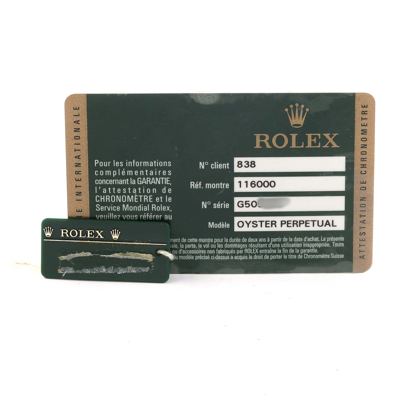 The image shows a Rolex Oyster Perpetual 116000 Men's Stainless Steel Black Dial warranty card and a tag with the Rolex logo.