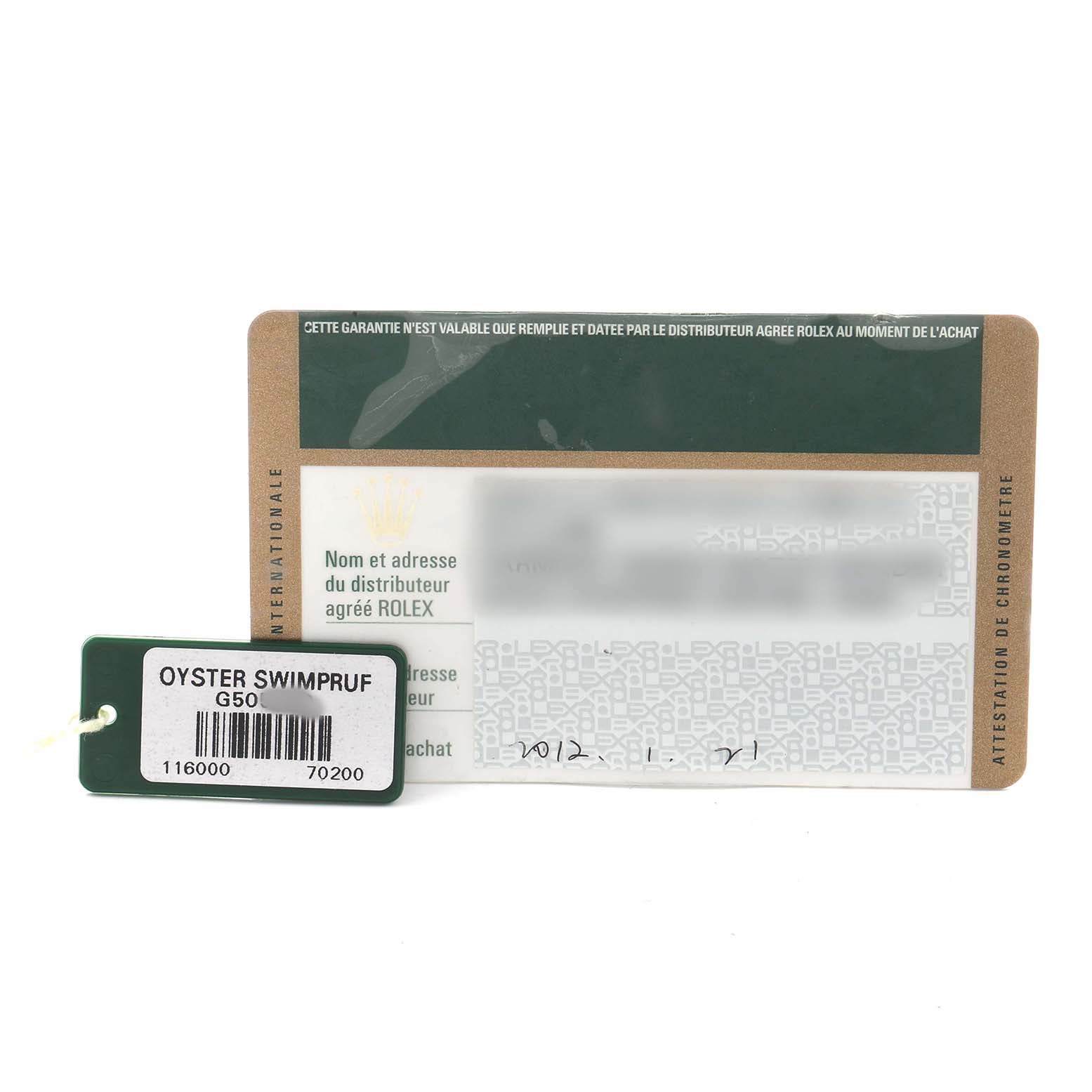 The image shows the warranty card and a green tag with details for the Rolex Oyster Perpetual 116000 Men's Stainless Steel Black Dial model.