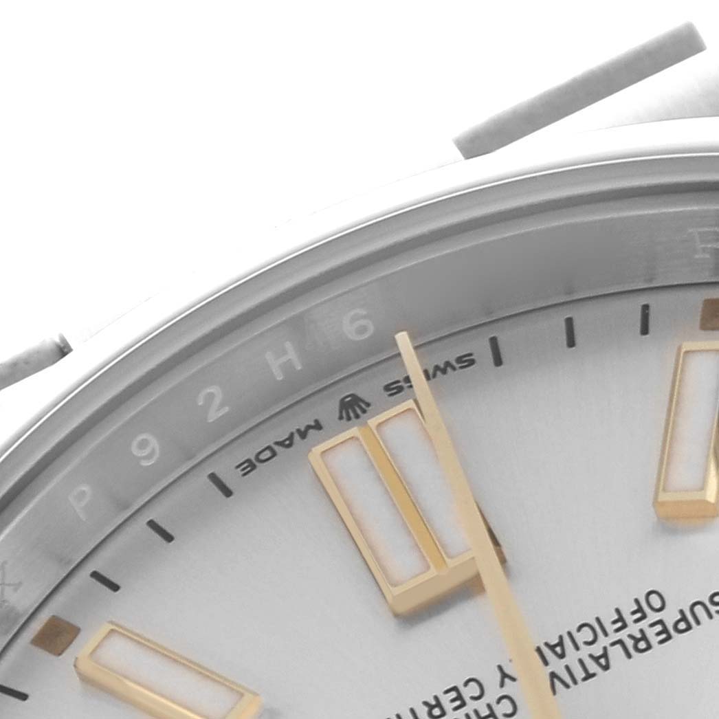 The close-up shows the dial and indices of a Rolex Oyster Perpetual 124300 Men's Stainless Steel Silver Dial 124300 Men's Stainless Steel Silver Dial, angled to highlight the markers and text.