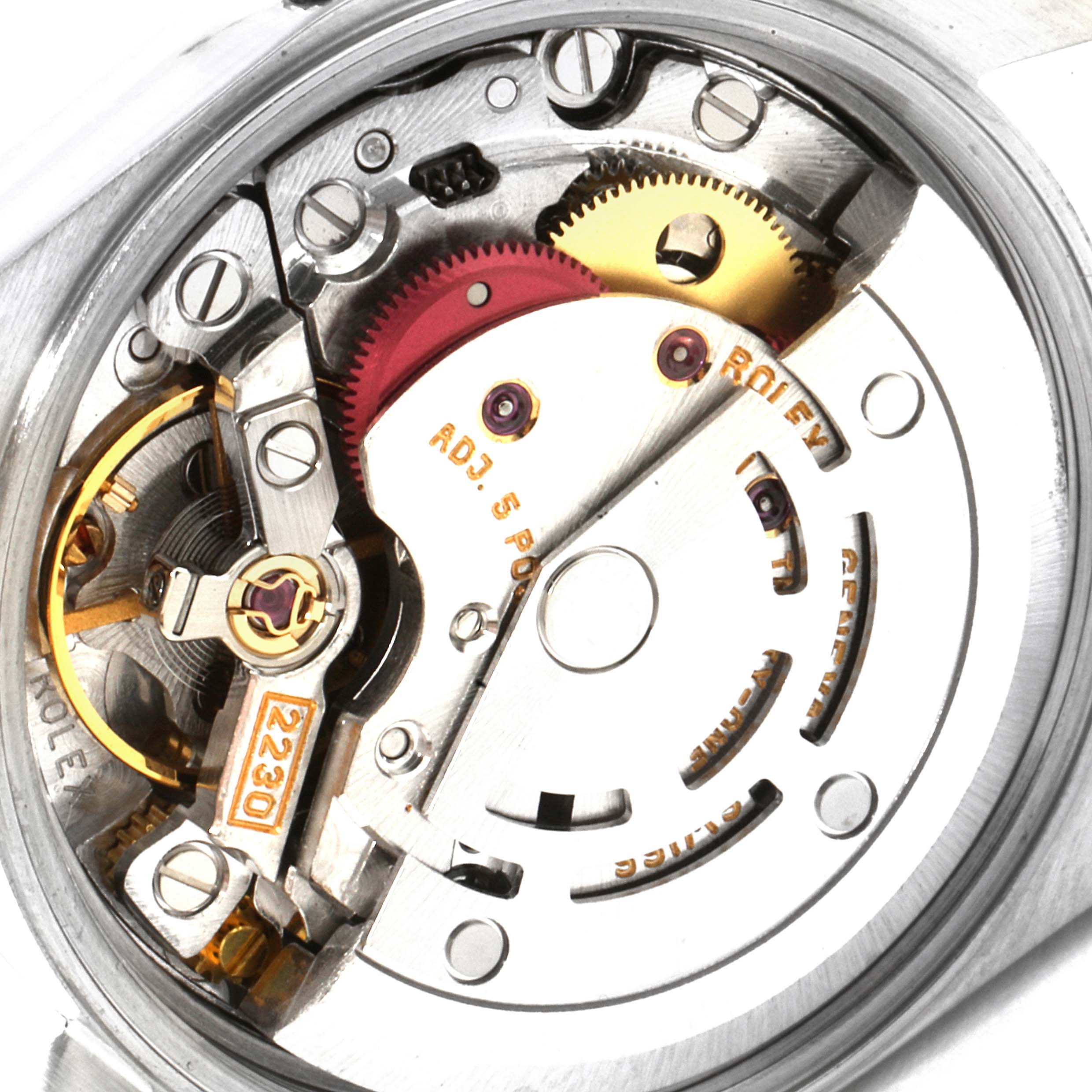 This is an internal view of the movement mechanism of a Rolex Oyster Perpetual 76030 Women's Stainless Steel White Dial 76030 Women's Stainless Steel White Dial watch, showing gears and screws.