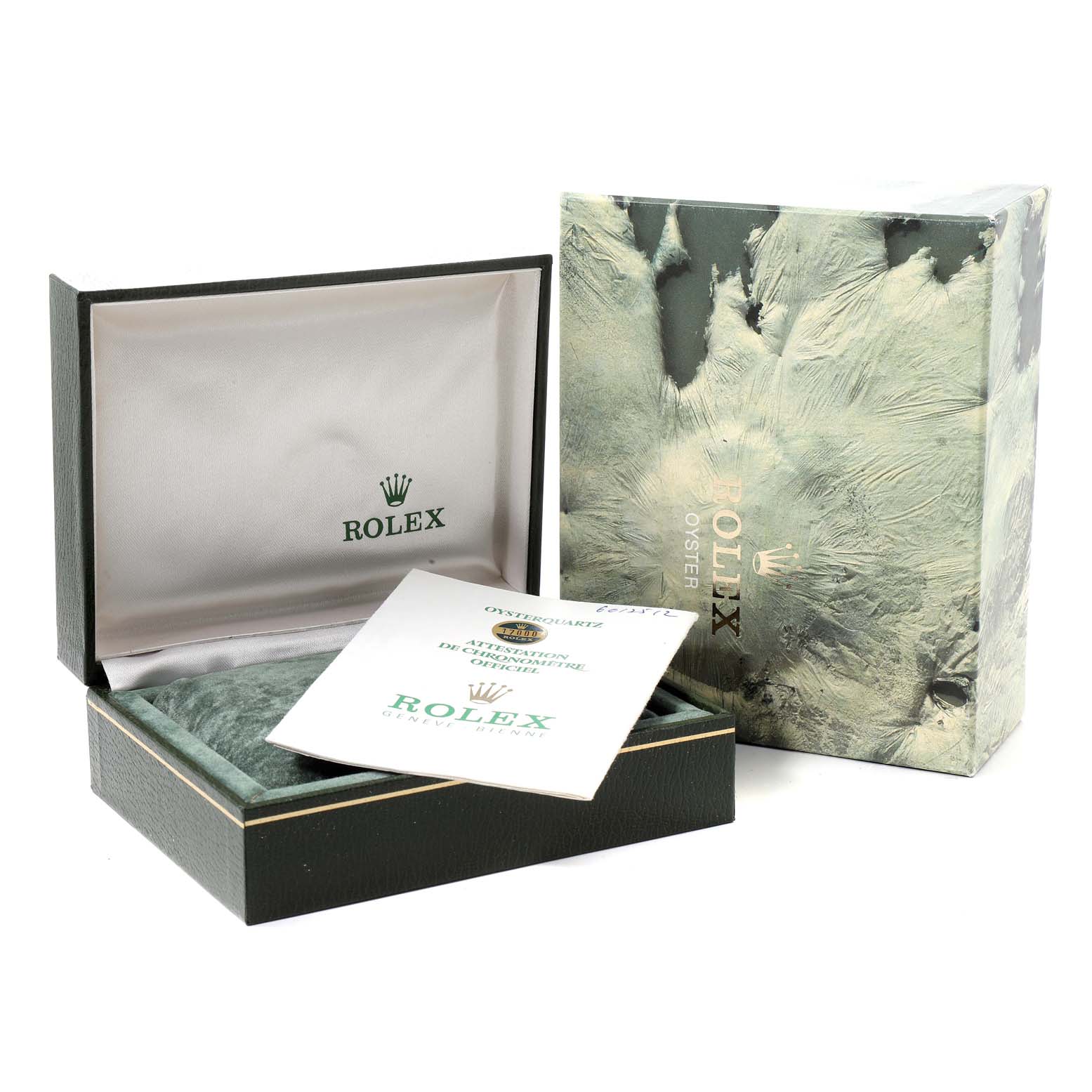 This image shows a Rolex Oysterquartz 17000 Men's Stainless Steel Silver Dial 17000 Men's Stainless Steel Silver Dial watch box, certification papers, and the outer packaging at an angle.