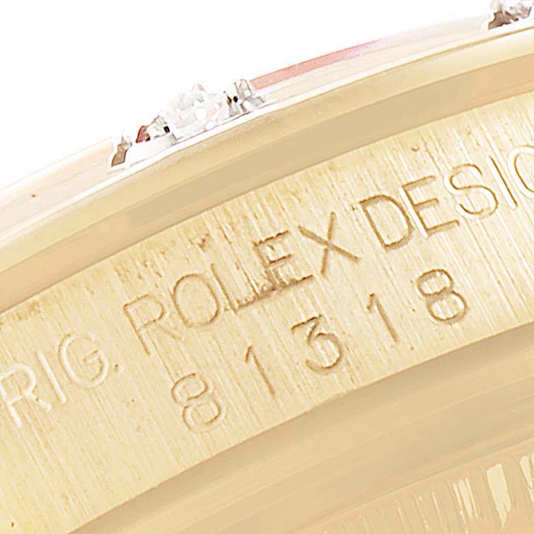 The image shows an up-close view of the side of a Rolex Pearlmaster 81318 Women's Yellow Gold Mother of Pearl Dial 81318 Women's Yellow Gold Mother of Pearl Dial, displaying the model number engraved on the case.