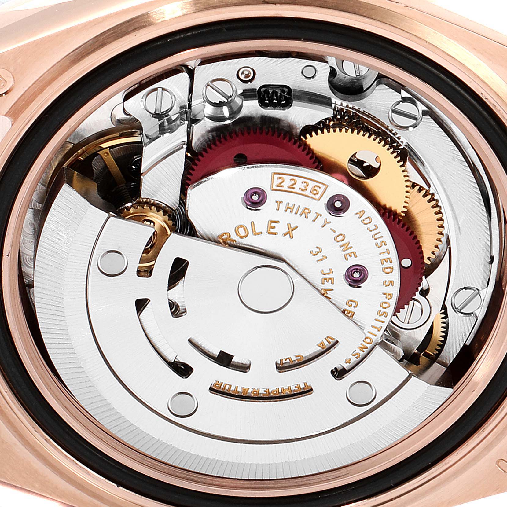 This image shows a close-up view of the internal mechanics of a Rolex President 279165 Women's Rose Gold Brown Dial 279165 Women's Rose Gold Brown Dial watch, highlighting gears and movement components.