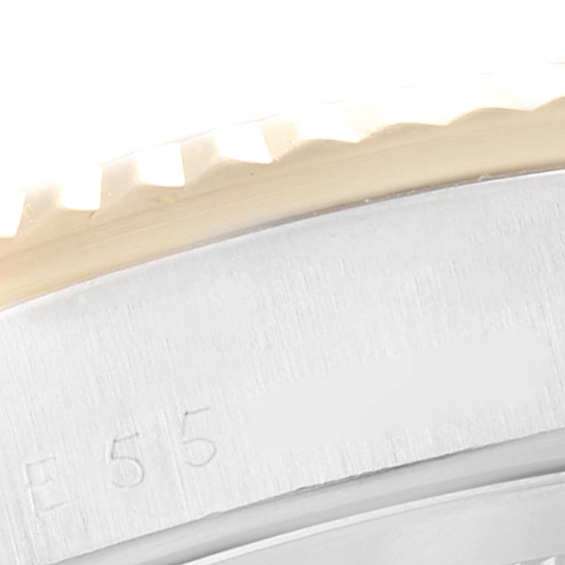 This close-up image features the fluted bezel and case of a Rolex President 18239 Men's White Gold Brown Dial 18239 Men's White Gold Brown Dial model watch.