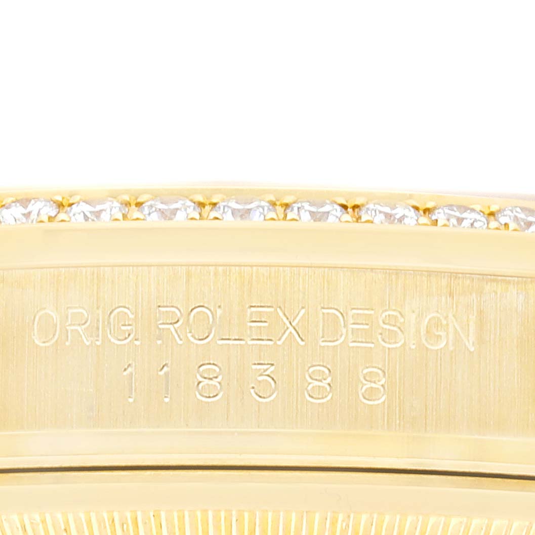 The image shows a close-up detail of the Rolex President 118388 Men's Yellow Gold Mother of Pearl Dial 118388 Men's Yellow Gold Mother of Pearl Dial model's side, highlighting the engraved design and diamonds.