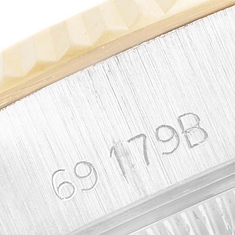 This close-up image shows the side of the Rolex President 69179 Women's White Gold Brown Dial 69179 Women's White Gold Brown Dial model watch case, highlighting its serial number.