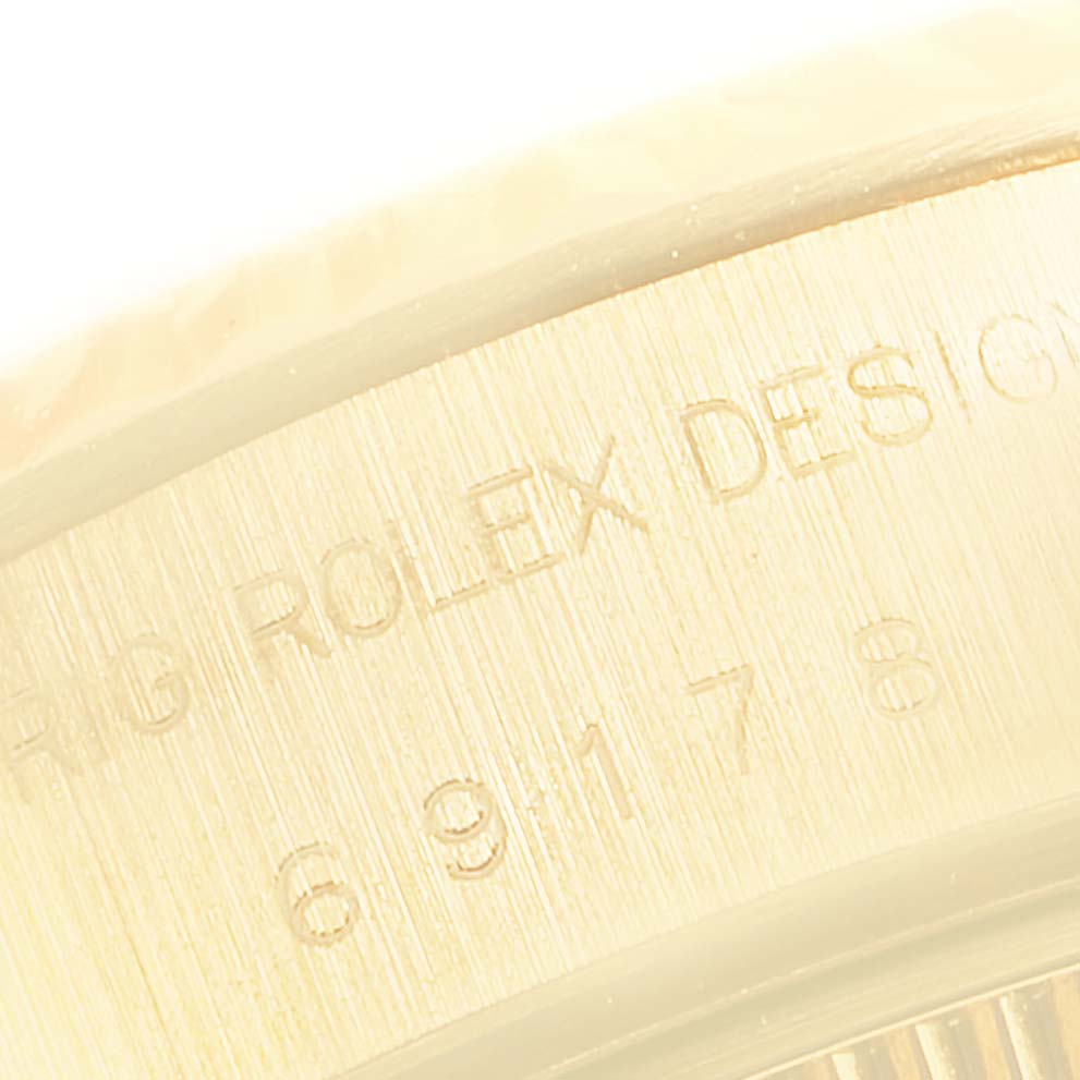 This image shows an engraved detail of the President model by Rolex from a close-up angle.