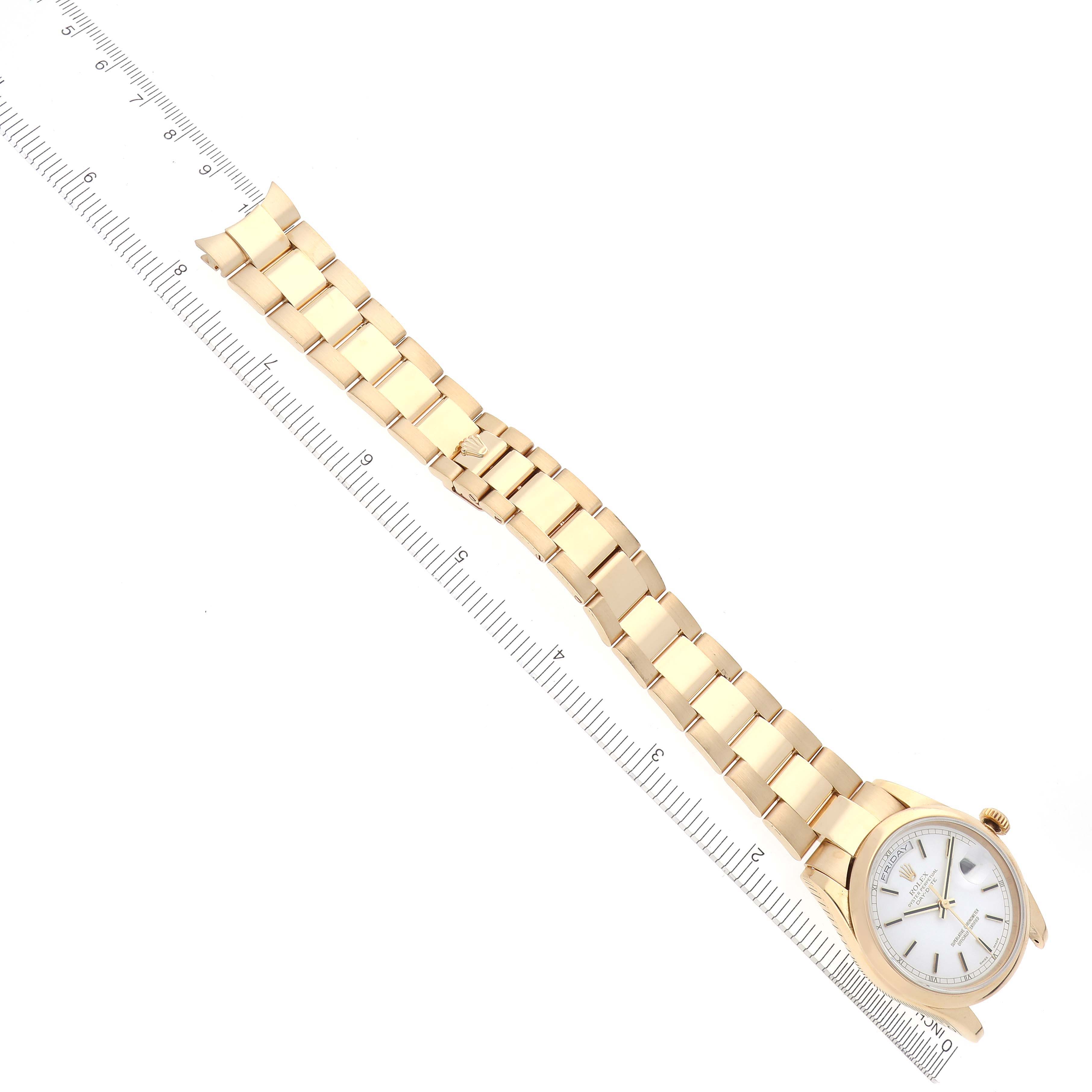 The Rolex President 118208 Men's Yellow Gold White Dial 118208 Men's Yellow Gold White Dial watch is shown at an angled top-down view, displaying its face and full bracelet.