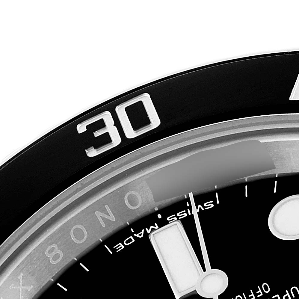 The image shows a close-up view of the bezel and part of the dial of a Rolex Submariner 114060 Men's Stainless Steel Black Dial 114060 Men's Stainless Steel Black Dial watch.
