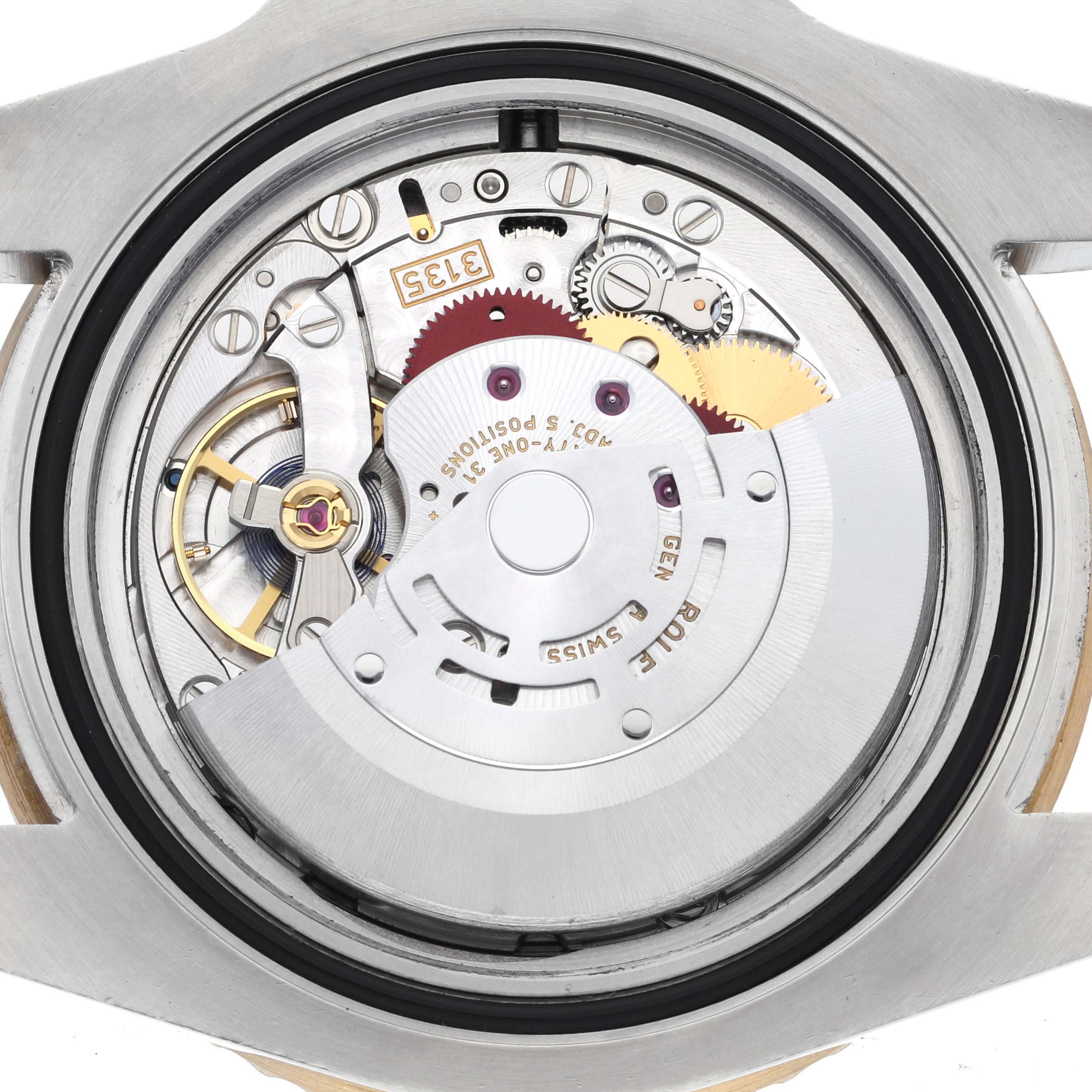 This image shows the movement and mechanical parts from the back of a Rolex Submariner 116613LN Men's Steel and Gold (two tone) Black Dial 116613LN Men's Steel and Gold (two tone) Black Dial watch.