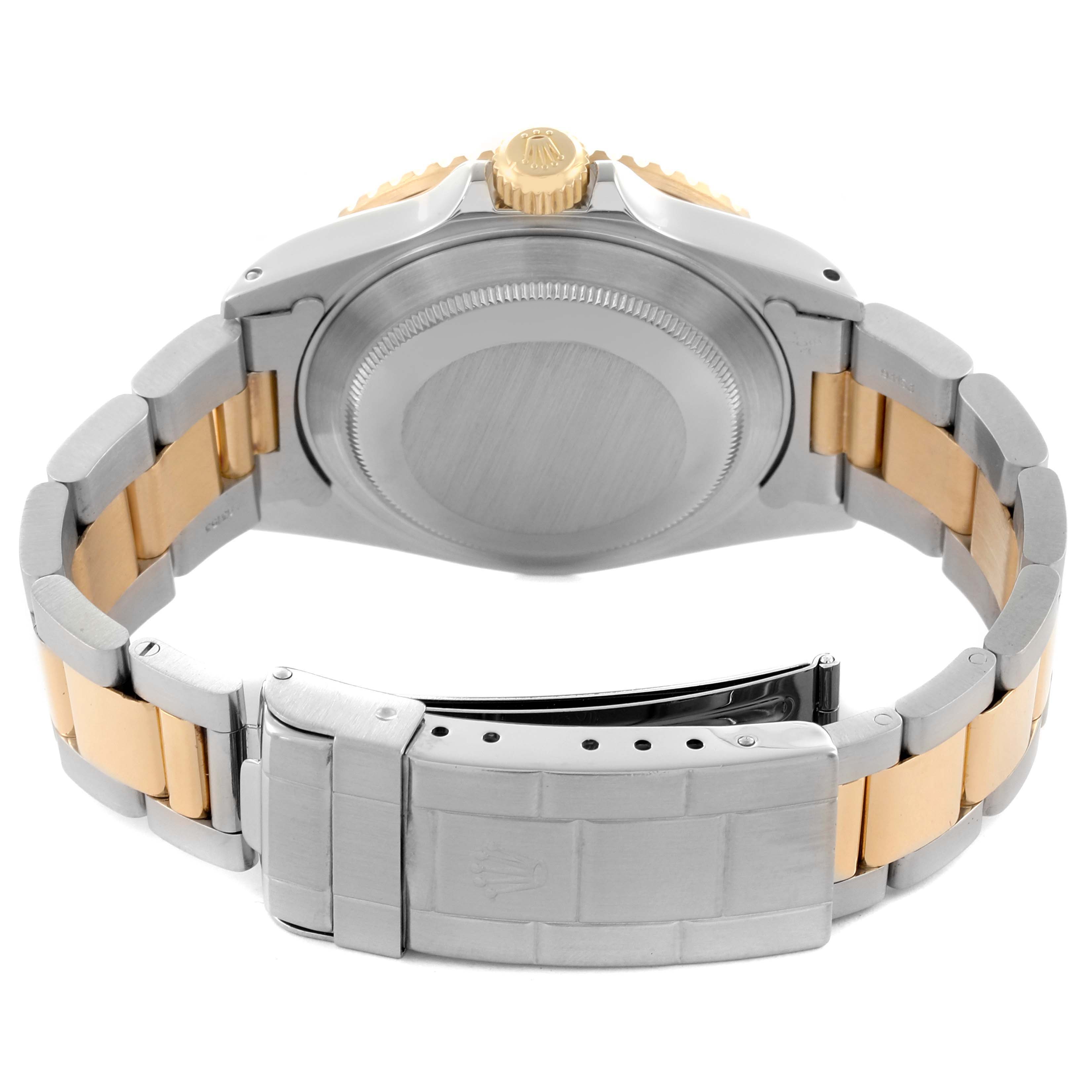 The image shows the back and clasp of a Rolex Submariner 16613 Men
s Steel and Gold (two tone) Black Dial 16613 Men
s Steel and Gold (two tone) Black Dial, highlighting the case back and two-tone bracelet.