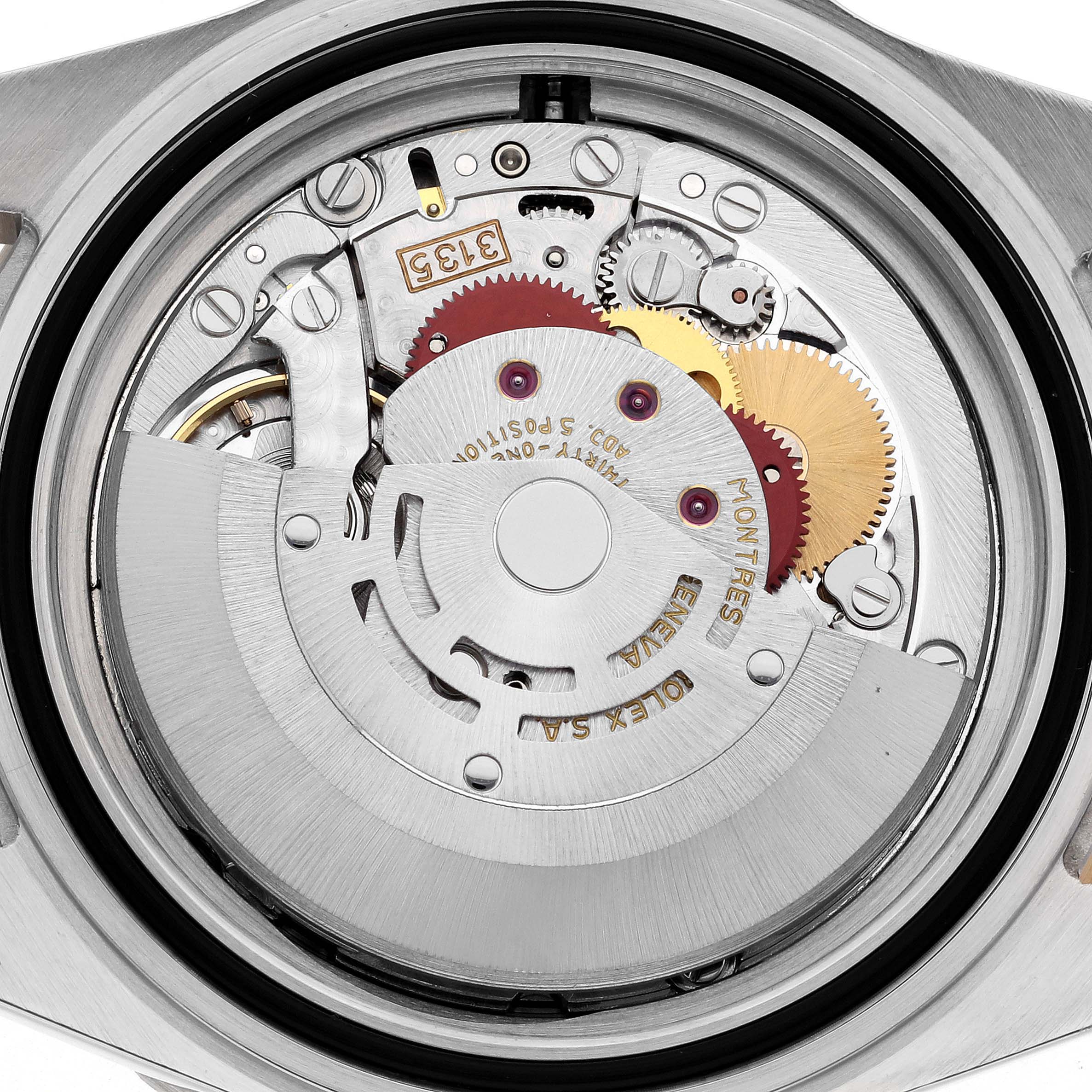 The image shows the internal movement of a Rolex Submariner 16613 Men
s Steel and Gold (two tone) Black Dial 16613 Men
s Steel and Gold (two tone) Black Dial from the back, highlighting gears and mechanisms.