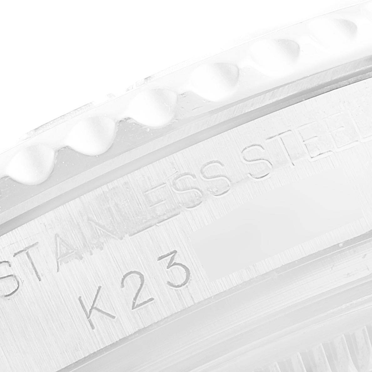 The close-up image shows the edge of a Rolex Yacht-Master 168622 Men
s Stainless Steel Silver Dial 168622 Men
s Stainless Steel Silver Dial watch case with engravings.