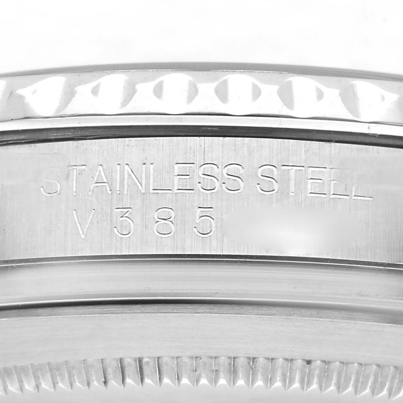 The image shows a close-up of the bezel and engraved edge of a Rolex Yacht-Master 16622 Men
s Stainless Steel Silver Dial 16622 Men
s Stainless Steel Silver Dial watch, highlighting its stainless steel construction.