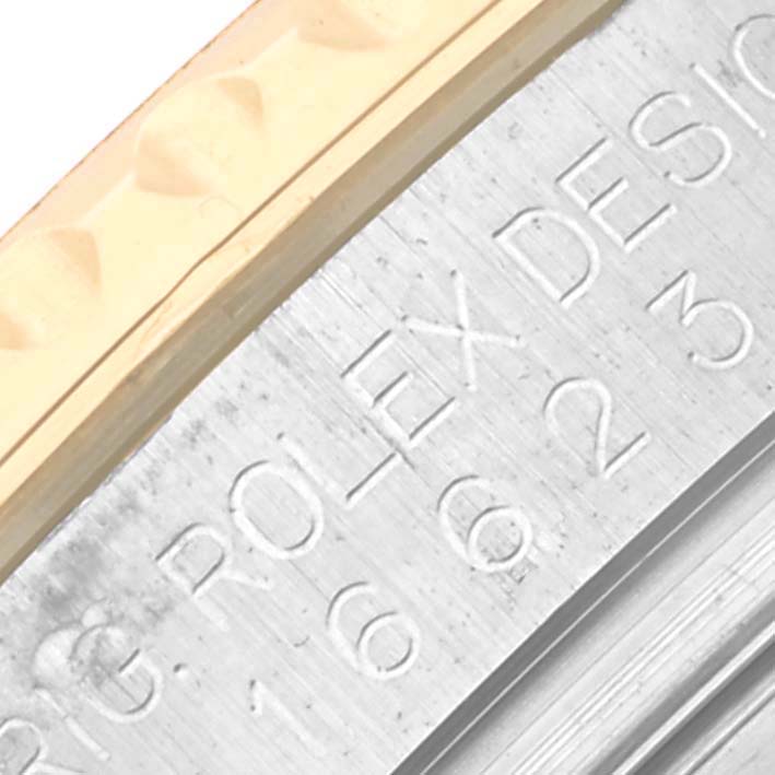 The image shows a close-up of the engraved side of the Rolex Yacht-Master 16623 Men's Steel and Gold (two tone) White Dial 16623 Men's Steel and Gold (two tone) White Dial watch case.