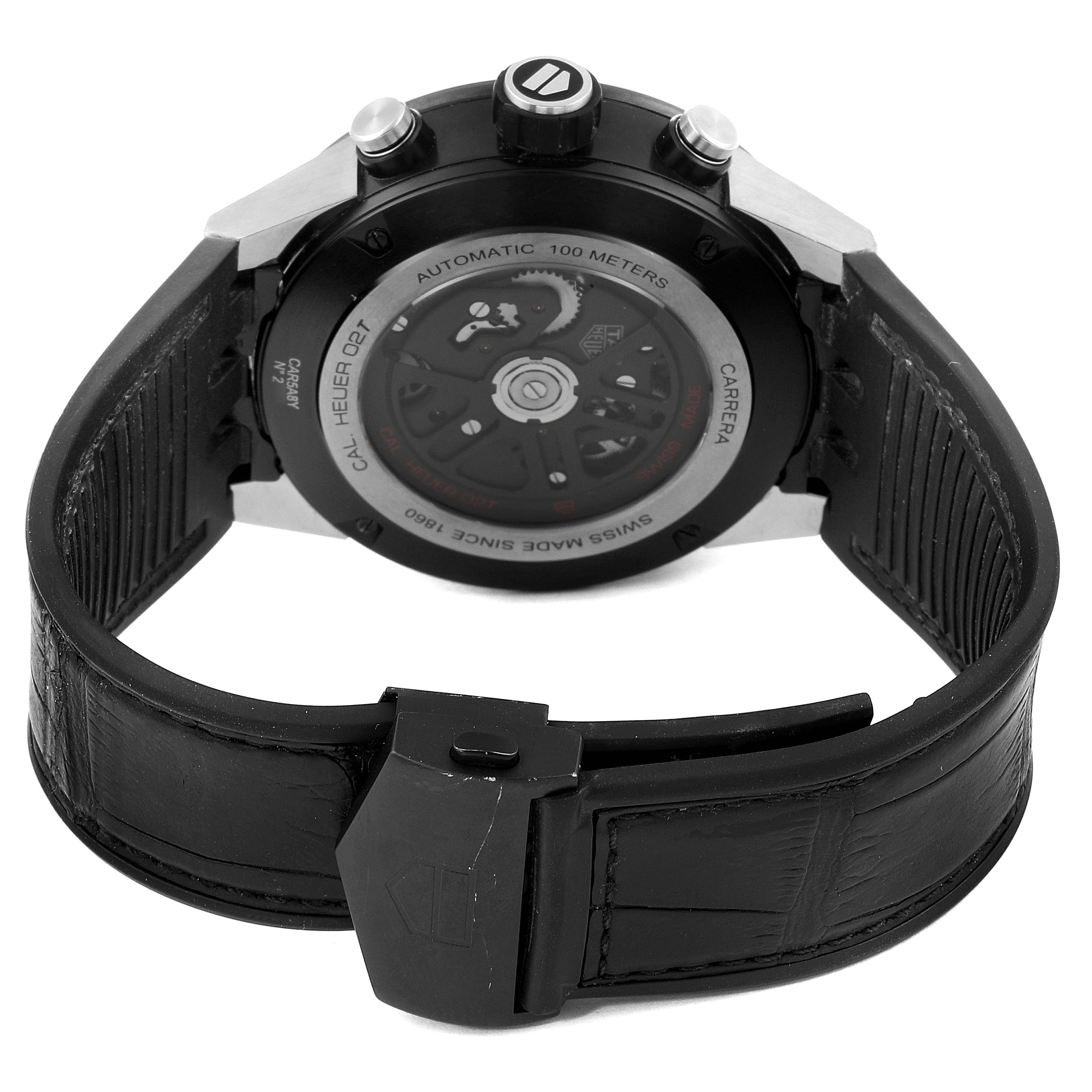 The image shows the back view of a Tag Heuer Carrera CAR5A8Y.FC6377 Men's Titanium Black Dial CAR5A8Y.FC6377 Men's Titanium Black Dial watch, highlighting its automatic movement and black leather strap.