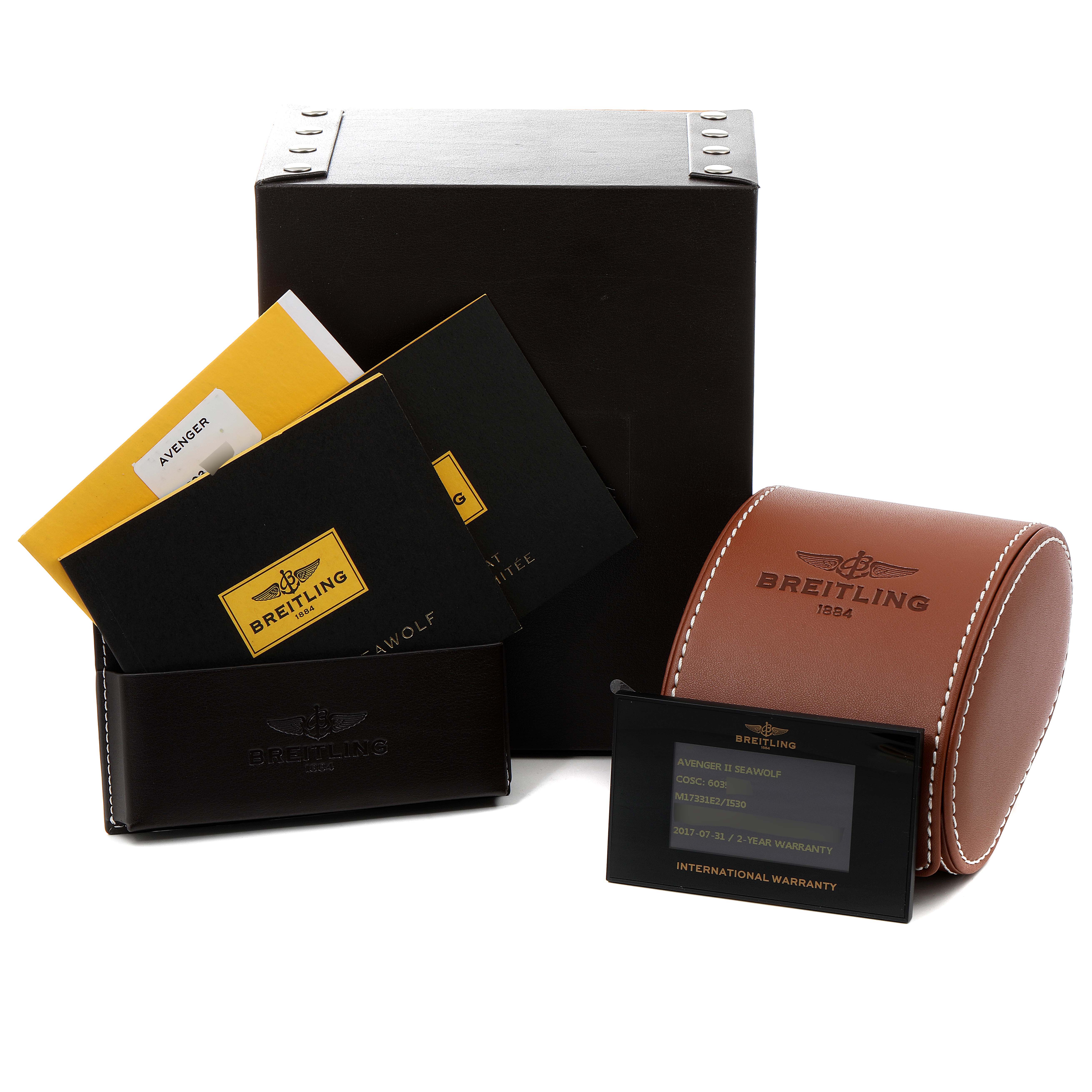 The image shows the packaging, warranty card, and manuals for the Breitling Avenger M17331 Men's Stainless Steel Yellow Dial M17331 Men's Stainless Steel Yellow Dial model watch.