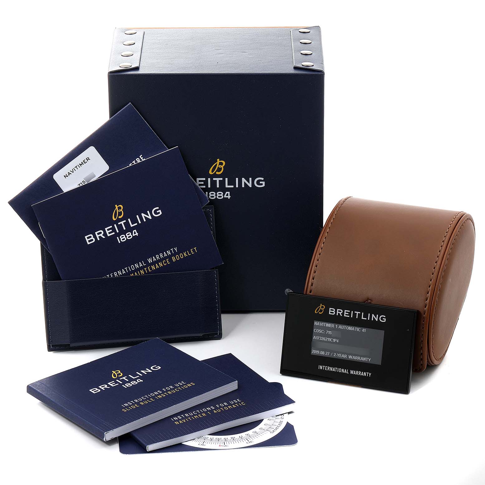 The image shows the packaging, warranty card, booklets, and a leather pouch for a Breitling Navitimer A17326 Men's Stainless Steel Blue Dial A17326 Men's Stainless Steel Blue Dial watch.