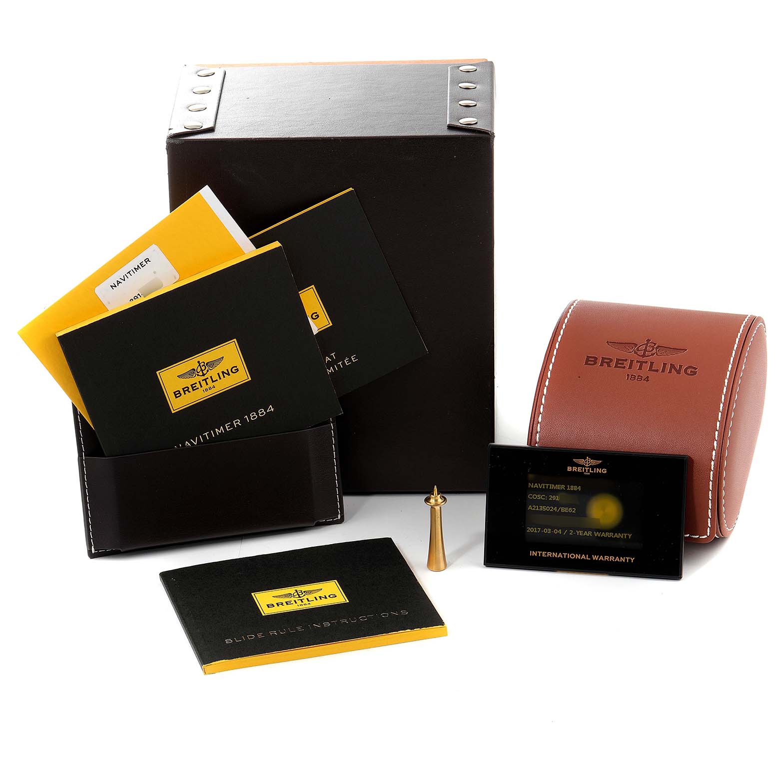 This image shows the packaging, manuals, a leather case, warranty card, and accessories for a Breitling Navitimer A2135024/BE62-453A Men's Stainless Steel Black Dial A2135024/BE62-453A Men's Stainless Steel Black Dial watch.
