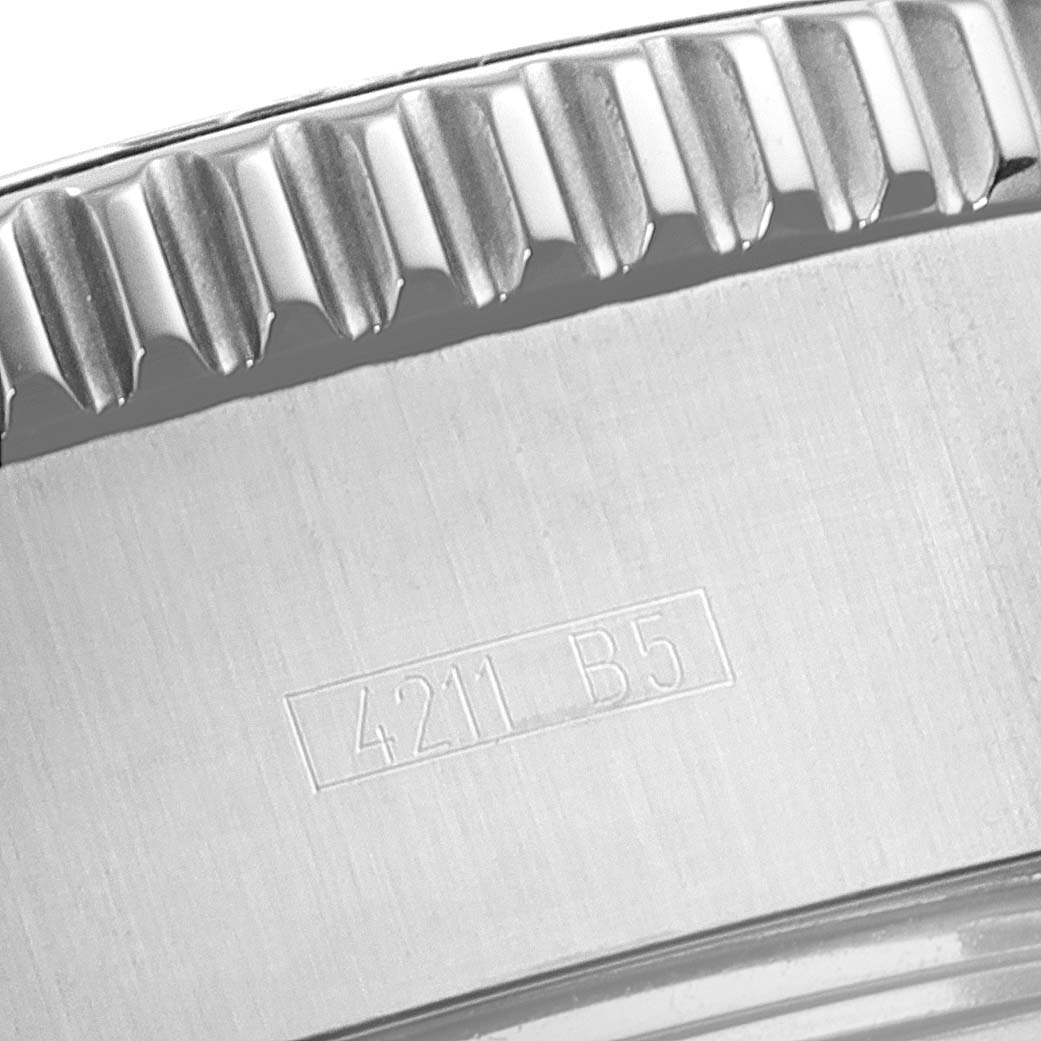 This close-up image shows the bezel's edge and case of the Breitling Superocean A13341 Men's Stainless Steel Black Dial A13341 Men's Stainless Steel Black Dial watch, featuring engraved text.