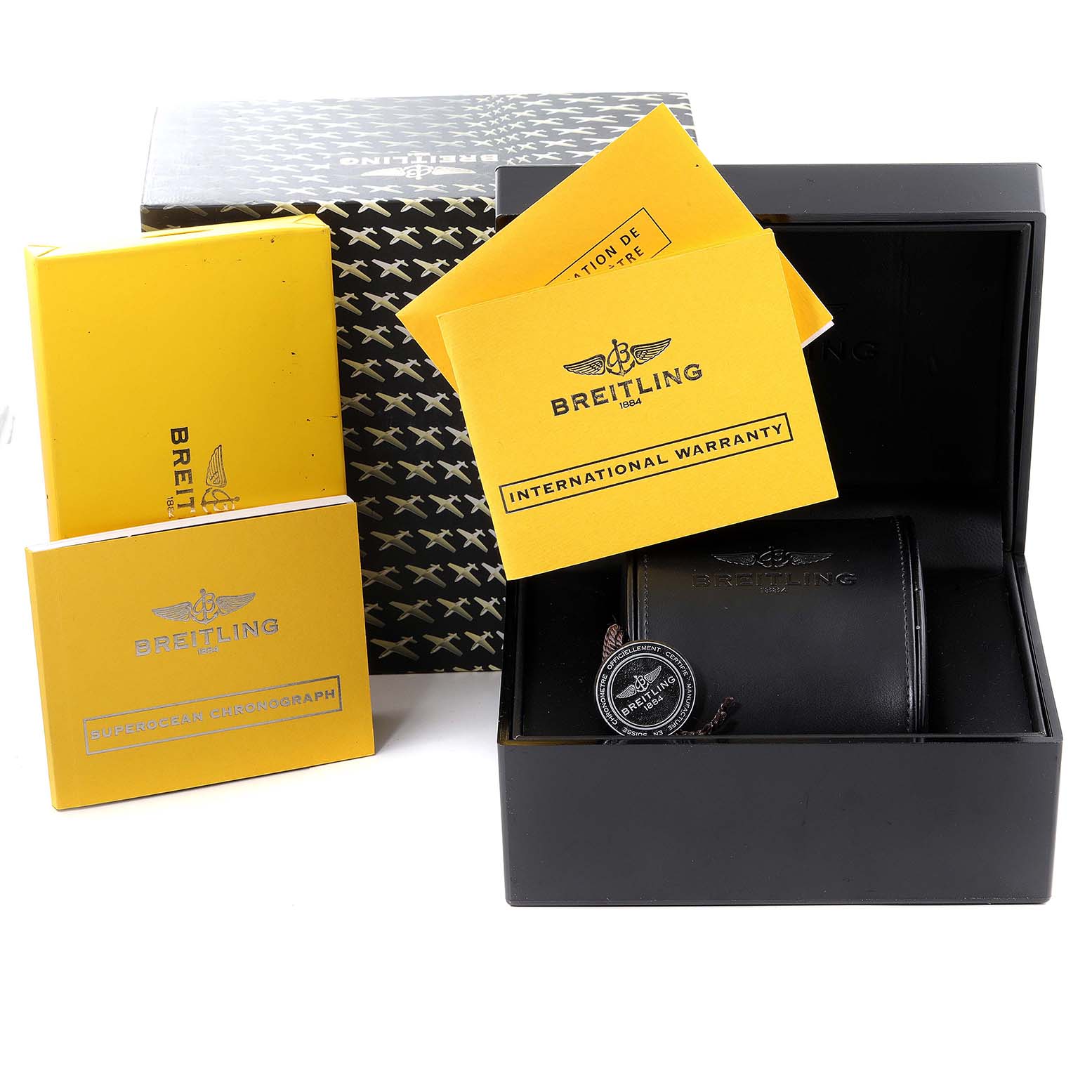 The image shows the packaging, warranty cards, and instruction manuals for the Breitling Superocean A13341 Men's Stainless Steel Black Dial A13341 Men's Stainless Steel Black Dial watch.