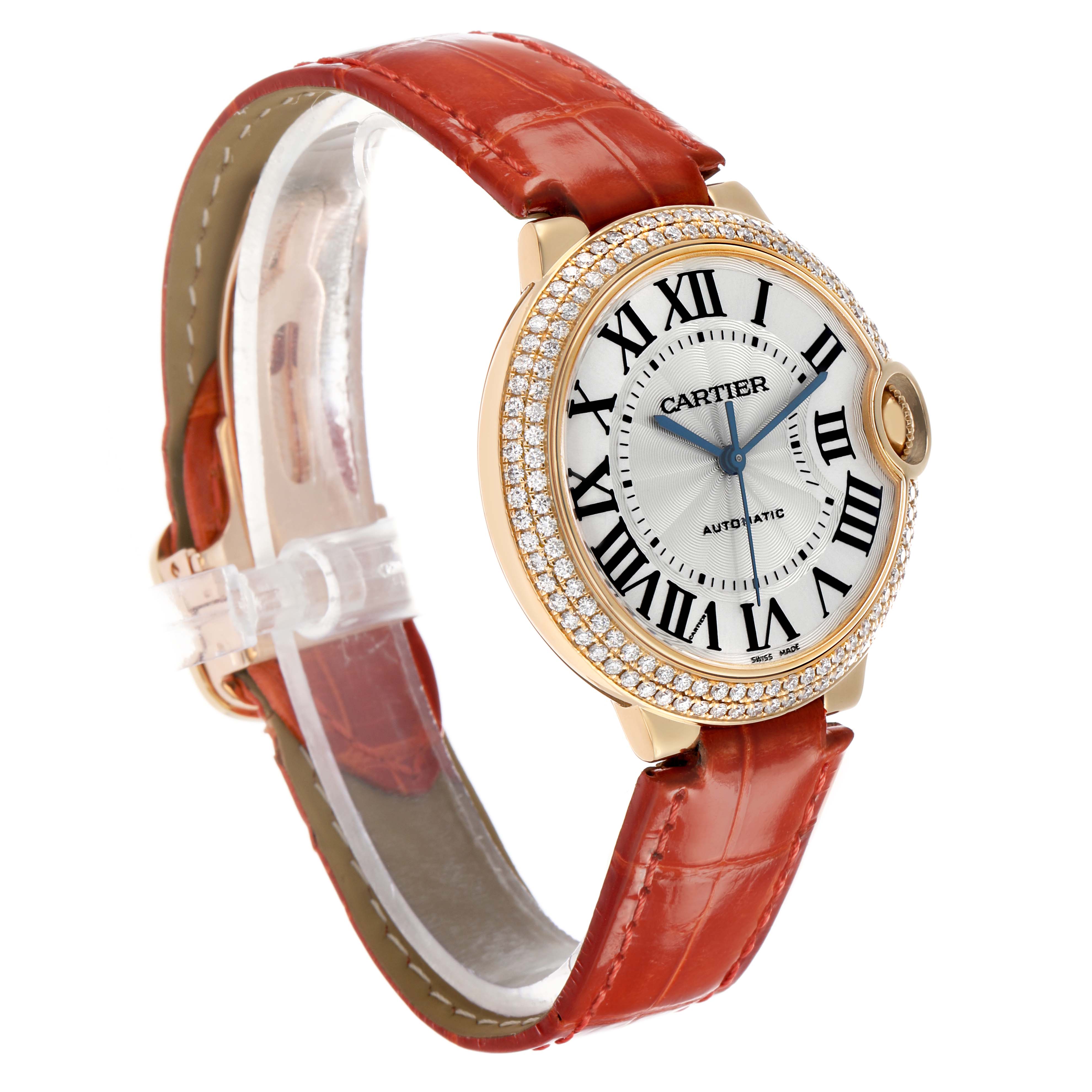 The Cartier Ballon Bleu WE900451 Men's Yellow Gold Silver Dial watch is shown at a three-quarter angle, highlighting its face, Roman numerals, and red strap.