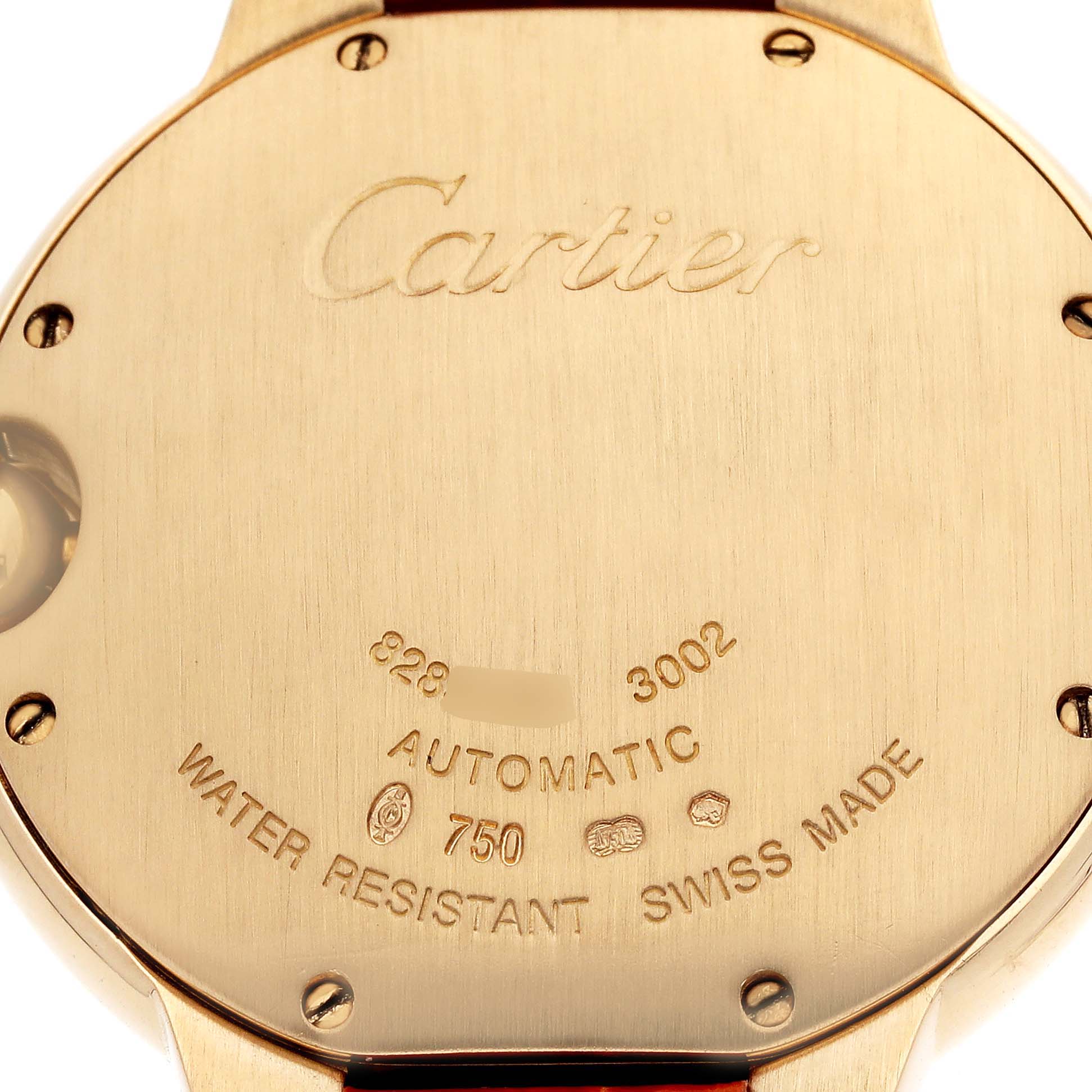 The image shows the back of a Cartier Ballon Bleu WE900451 Men's Yellow Gold Silver Dial watch, featuring engravings and screws.