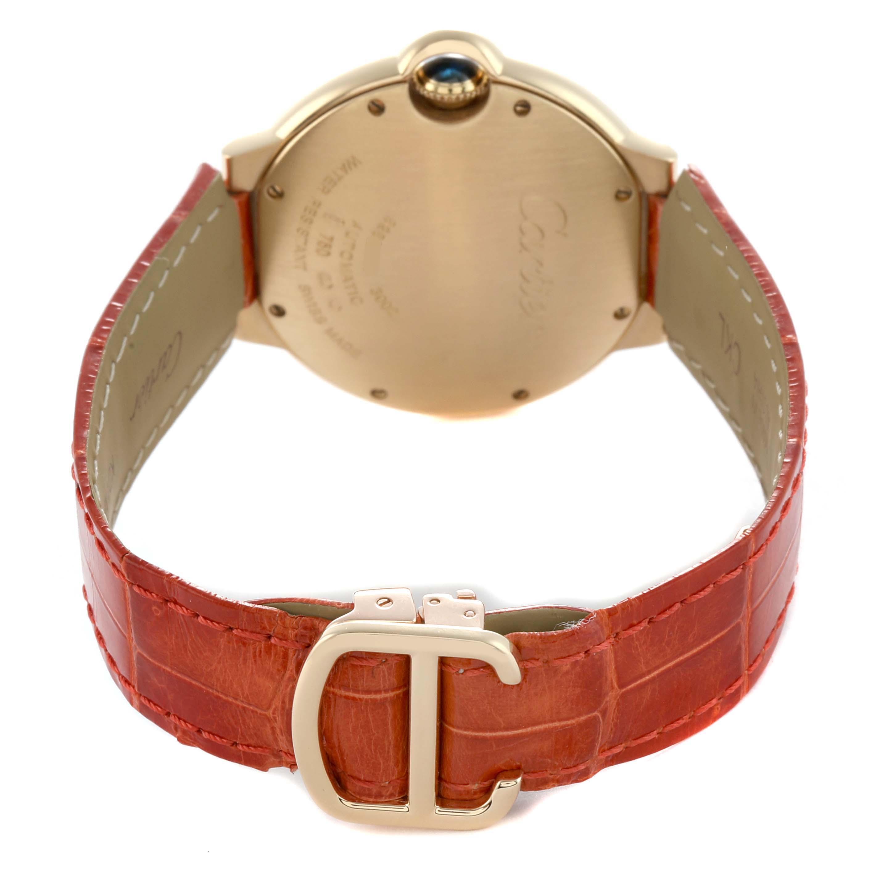 The image shows the back of a Cartier Ballon Bleu WE900451 Men's Yellow Gold Silver Dial watch with a red leather strap and gold clasp.