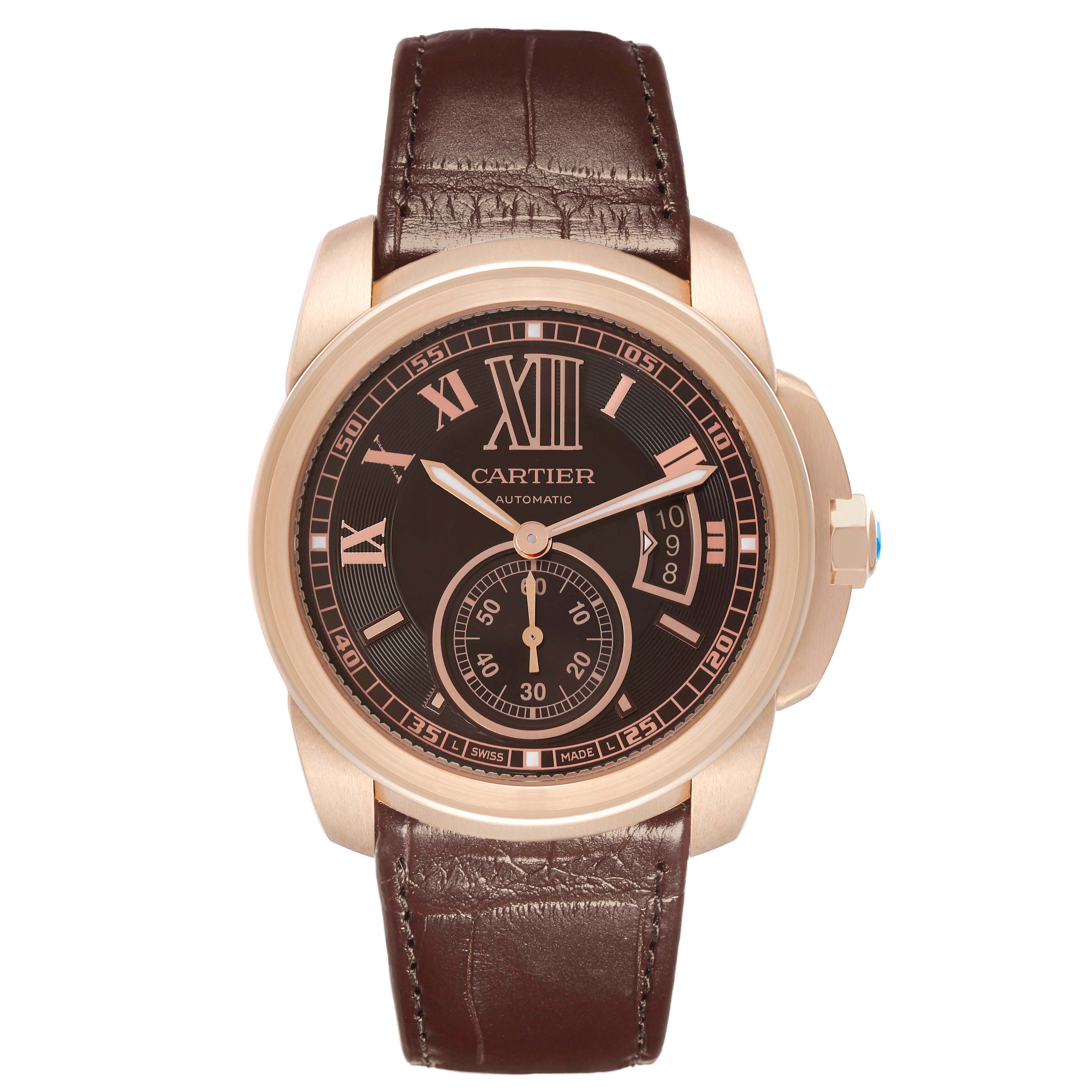 The Calibre de Cartier model W7100007 is shown from the front, highlighting its face, hands, sub-dial, date window, and brown leather strap.