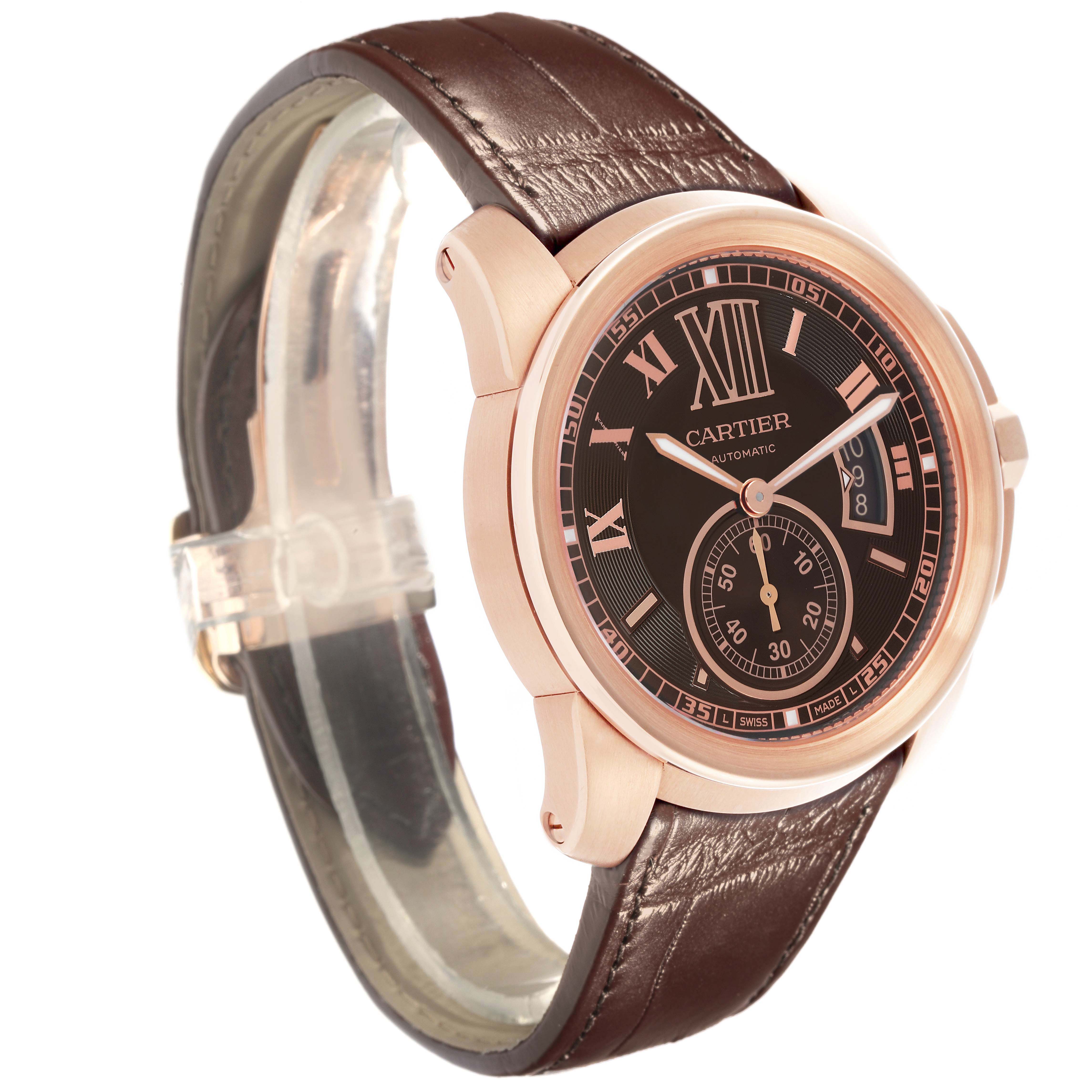 The Calibre de Cartier W7100007 men's watch is displayed at a three-quarter angle, showing the dial, case, brown leather strap, and crown.