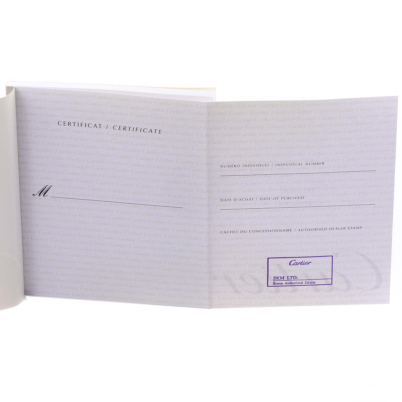 This image shows the certificate booklet for the Cartier Rotonde W1556239 Men's White Gold Blue Dial W1556239 Men's White Gold Blue Dial model watch, displaying space for details and a dealer stamp.