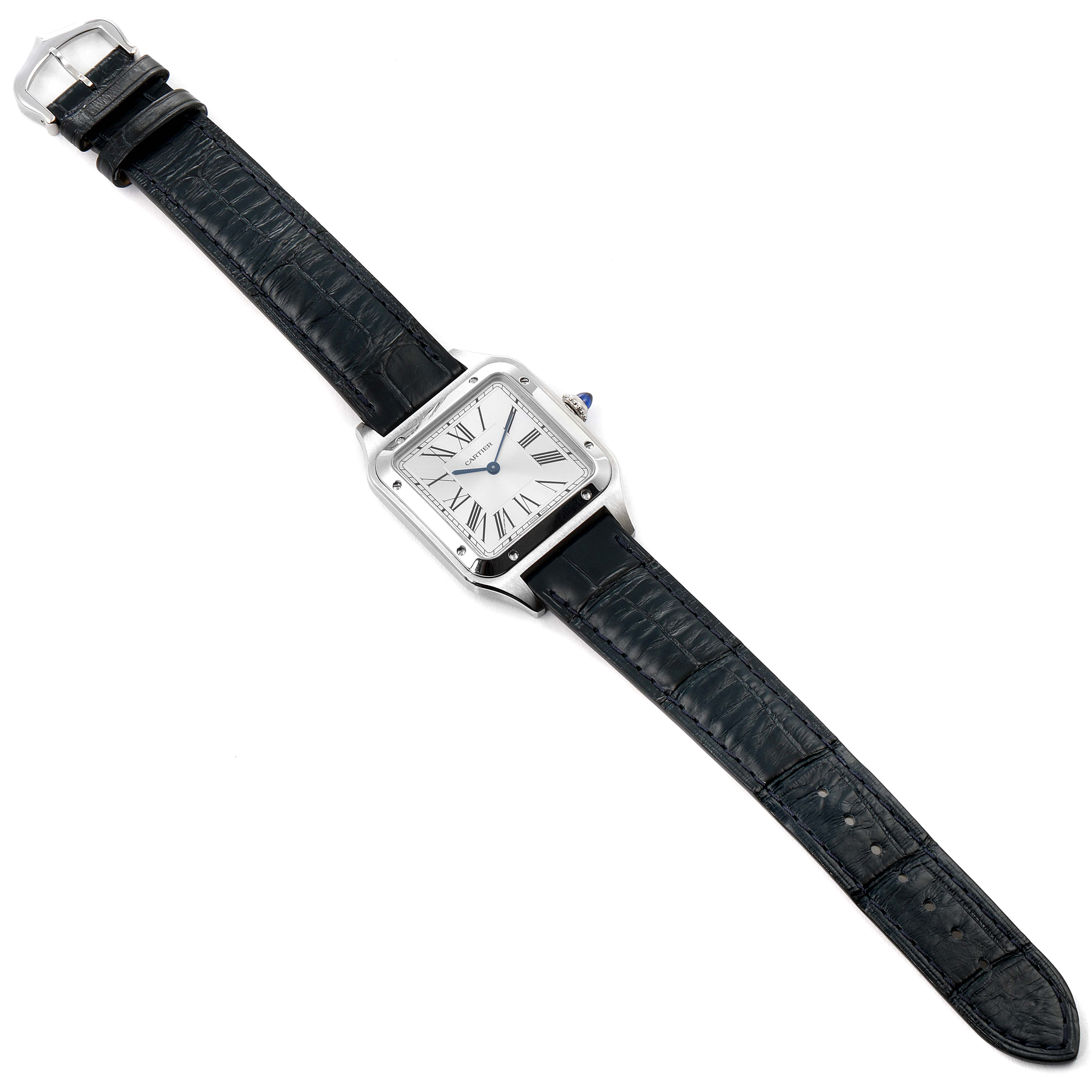 The Cartier Santos Dumont WSSA0022 Men's Stainless Steel Silver Dial WSSA0022 Men's Stainless Steel Silver Dial watch is shown from a top view featuring its square face, Roman numerals, and black leather strap.