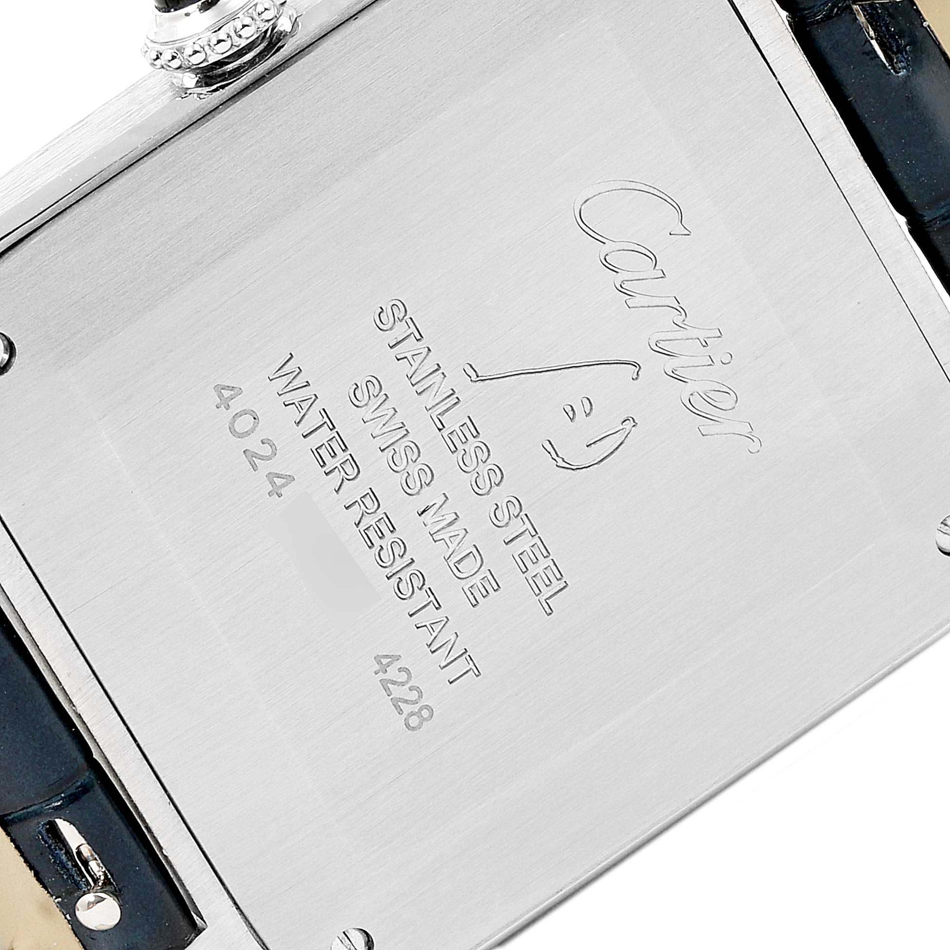 The image shows the back case of a Cartier Santos Dumont WSSA0022 Men's Stainless Steel Silver Dial WSSA0022 Men's Stainless Steel Silver Dial watch, revealing brand engraving and material details.