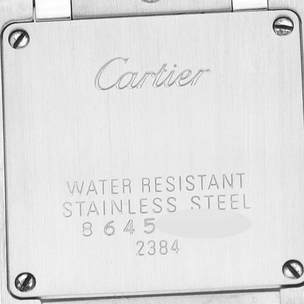 This image shows the back case of a Cartier Tank Française watch, highlighting its stainless steel and water resistance details.