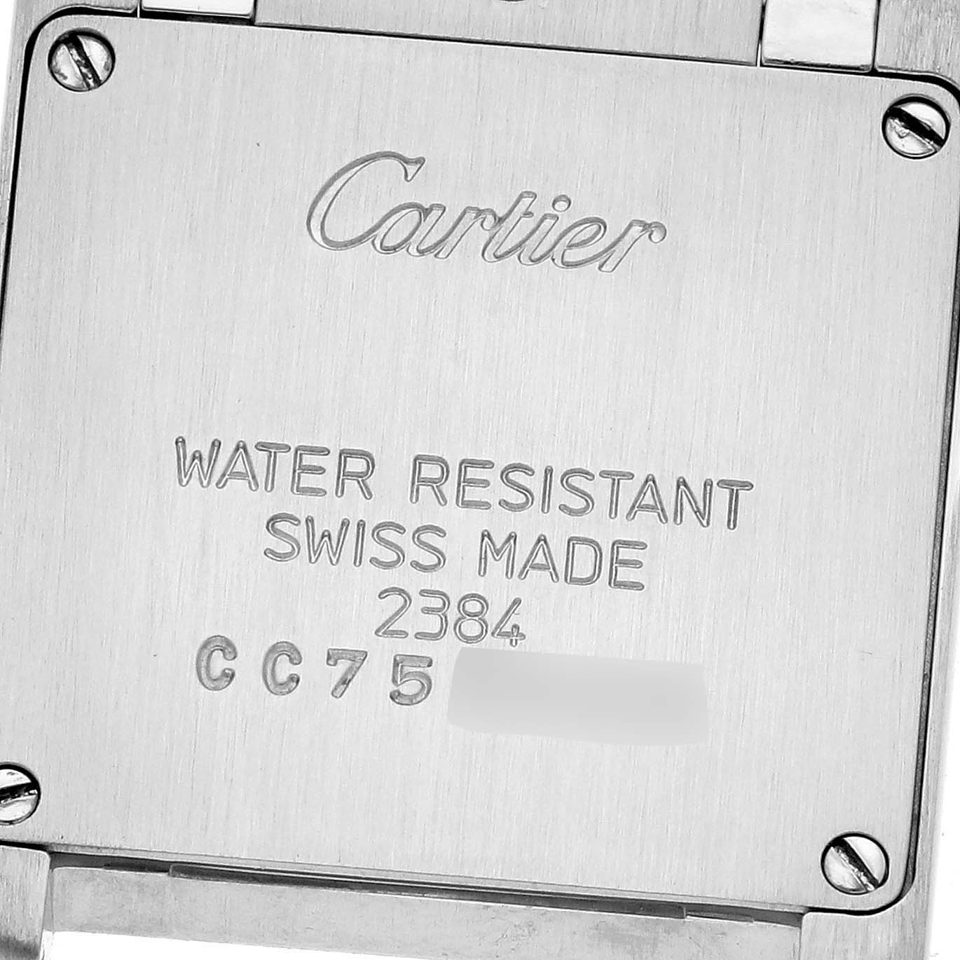 The image shows the back casing of the Cartier Tank Française watch, highlighting its engraved details.