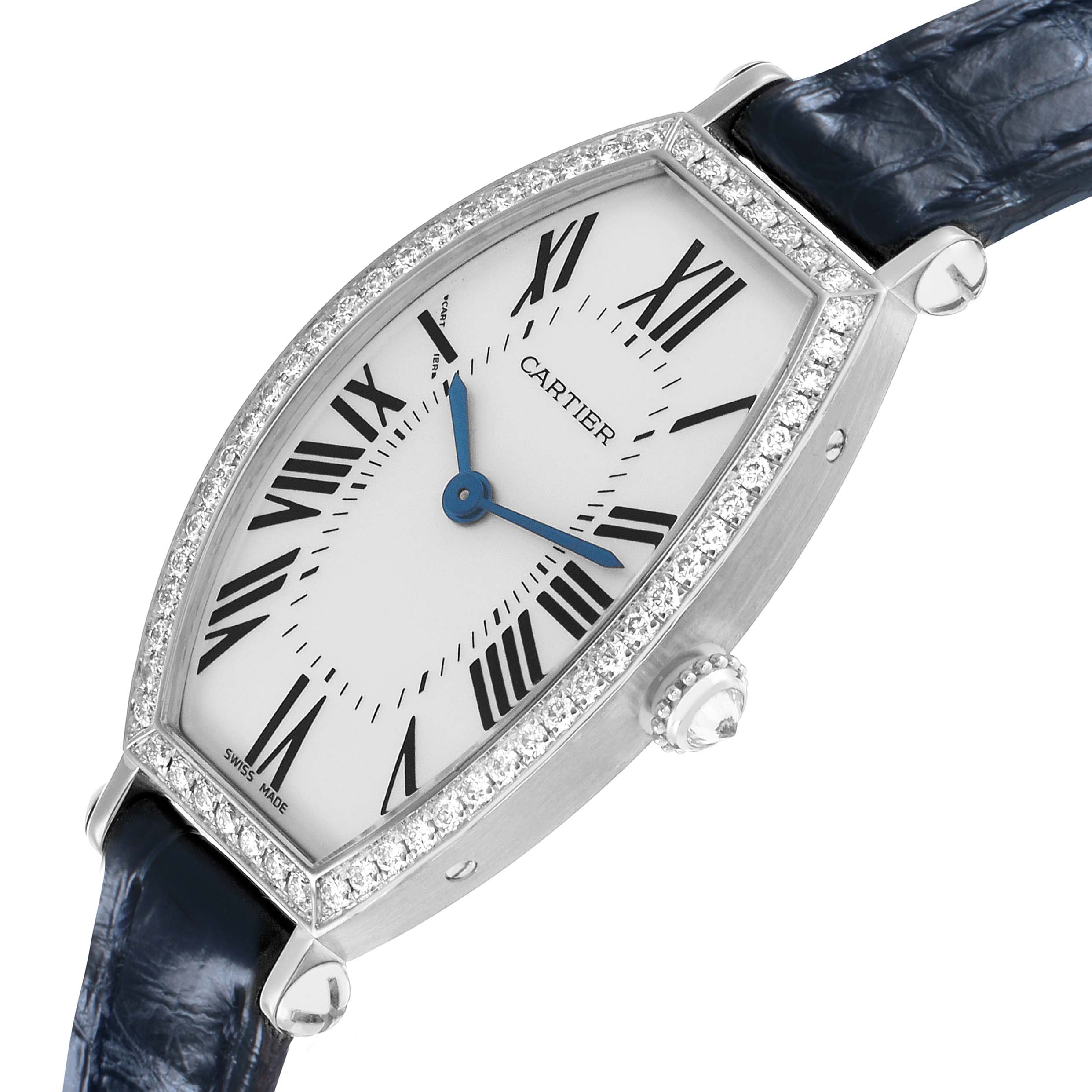 The Cartier Tonneau WE400131 Women's White Gold Silver Dial watch is shown at a slight angle, highlighting the diamond-studded bezel and blue leather strap.